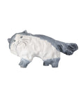 The Siamese Cat by Currey & Company, Inc. is a hand-painted figurine with a white body, blue-gray markings, simple facial details, and a bushy tail. Standing on all fours, it evokes the elegance of blue and white porcelain.