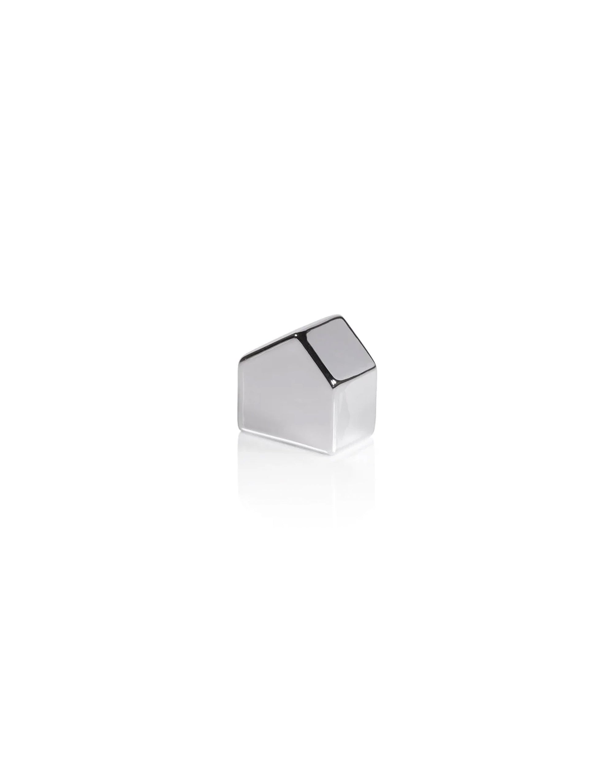 The Zodax Ceramic House Silver S is a small, geometric silver decor piece reminiscent of a minimalist house, shown on a white background with a subtle reflection.