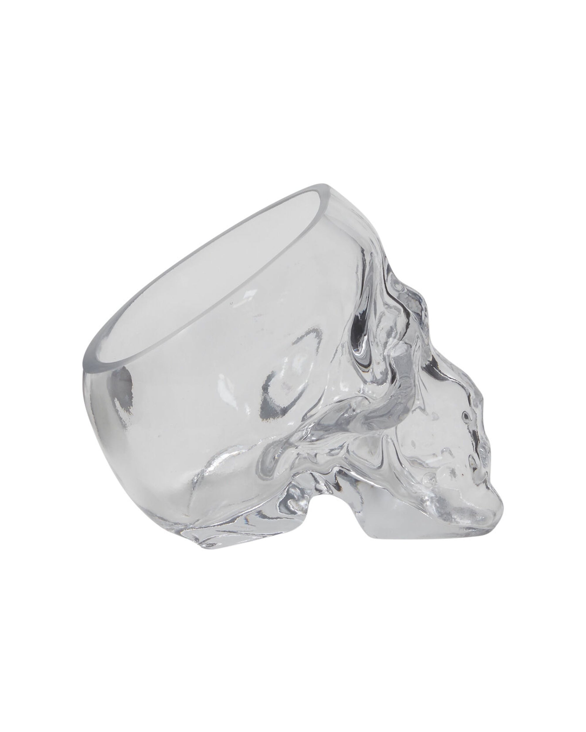 The Accent Decor Reaper Pot, a clear glass tumbler shaped like a human skull, makes a spooky planter or witchy decor piece and is shown lying on its side against a white background.