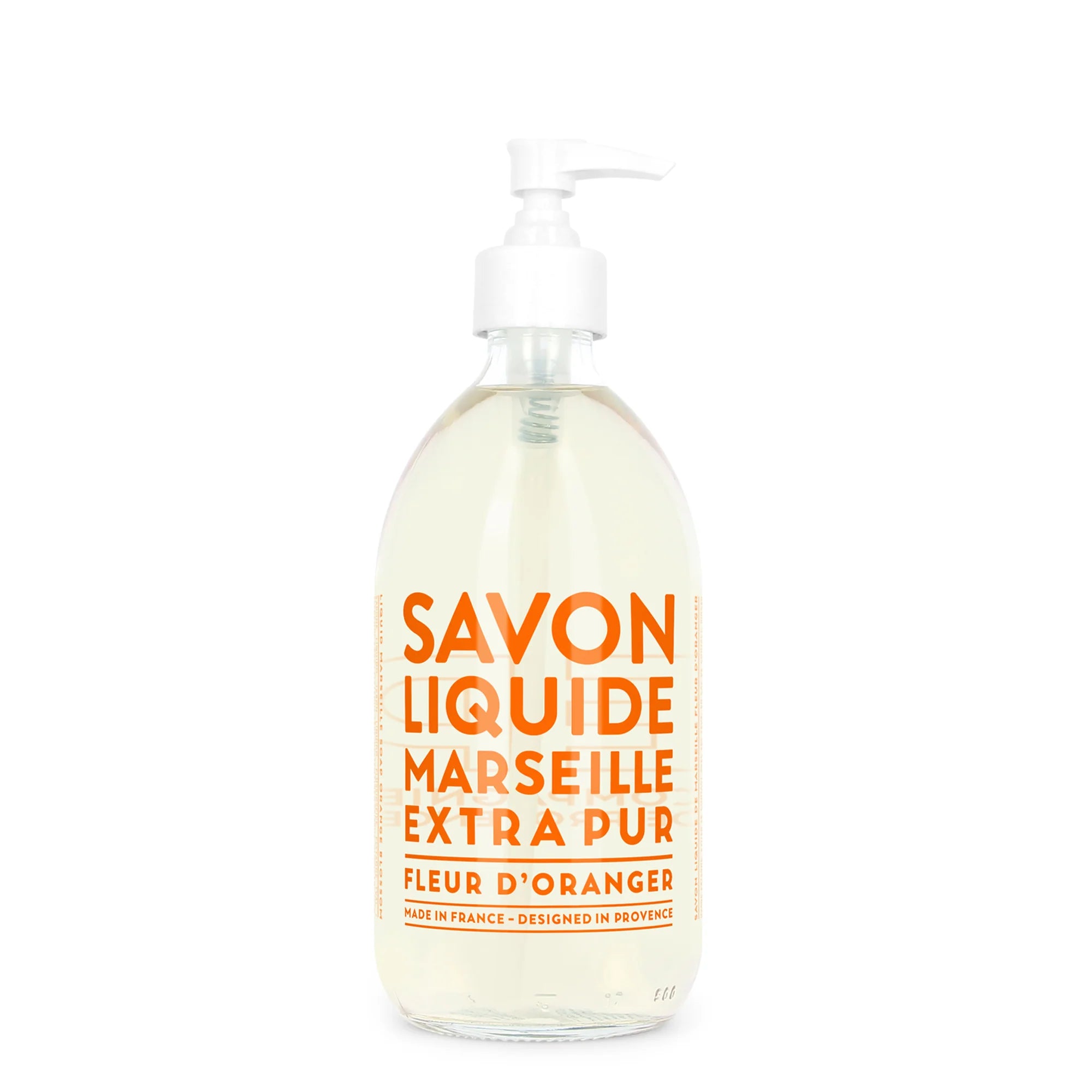 The Liquid Soap 16.7oz by Cie Luxe Brands features a clear glass pump bottle with orange text declaring "Savon Liquide Marseille Extra Pur, Fleur d'Oranger." The label highlights its Provence design, crafted from vegetable oils and made in France.