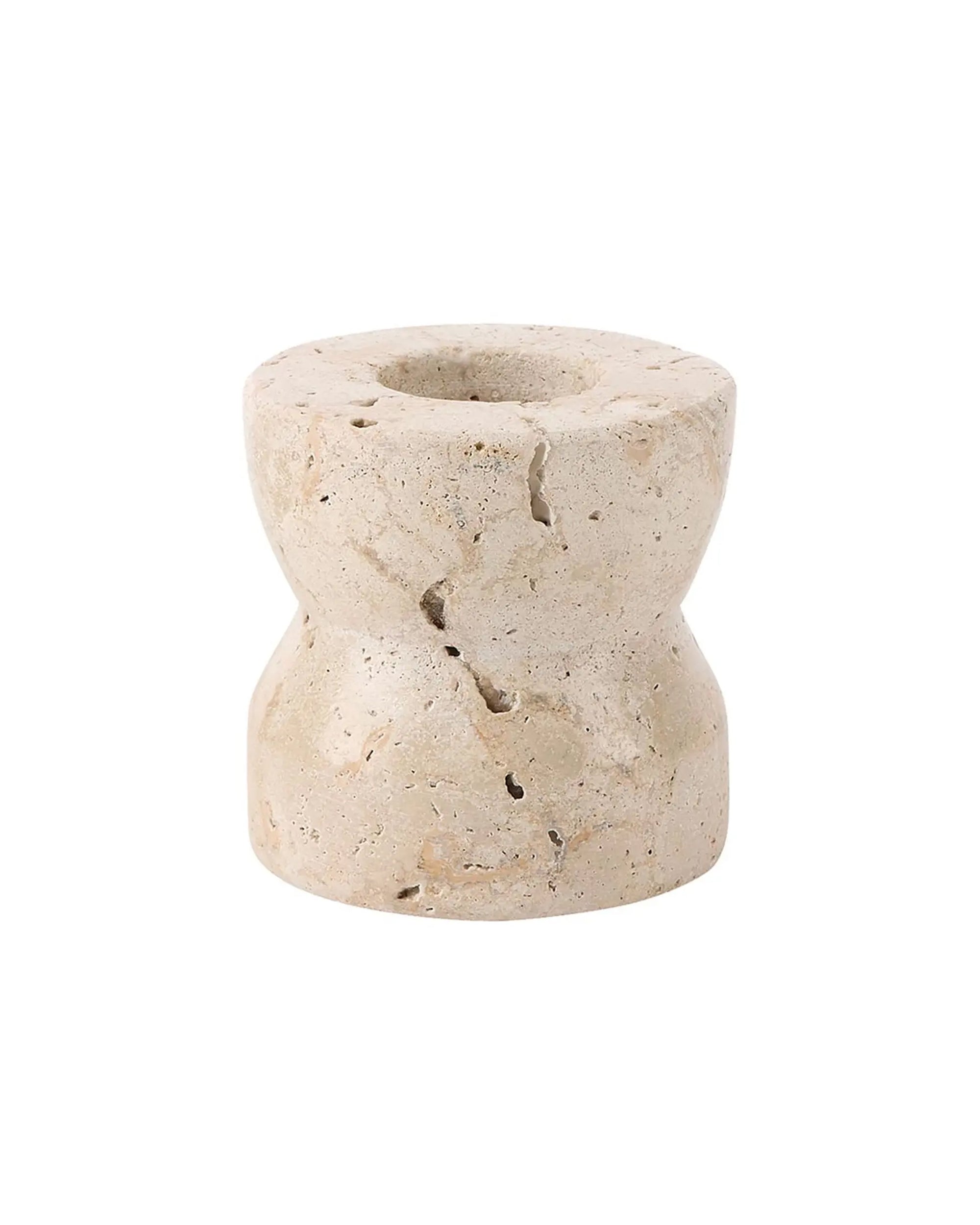 The Faire Travertine Marble Candle Holder features a small, beige, cylindrical design with an hourglass shape and central hole. Its natural rough textures and cracks give this marble decor an organic, rustic look.
