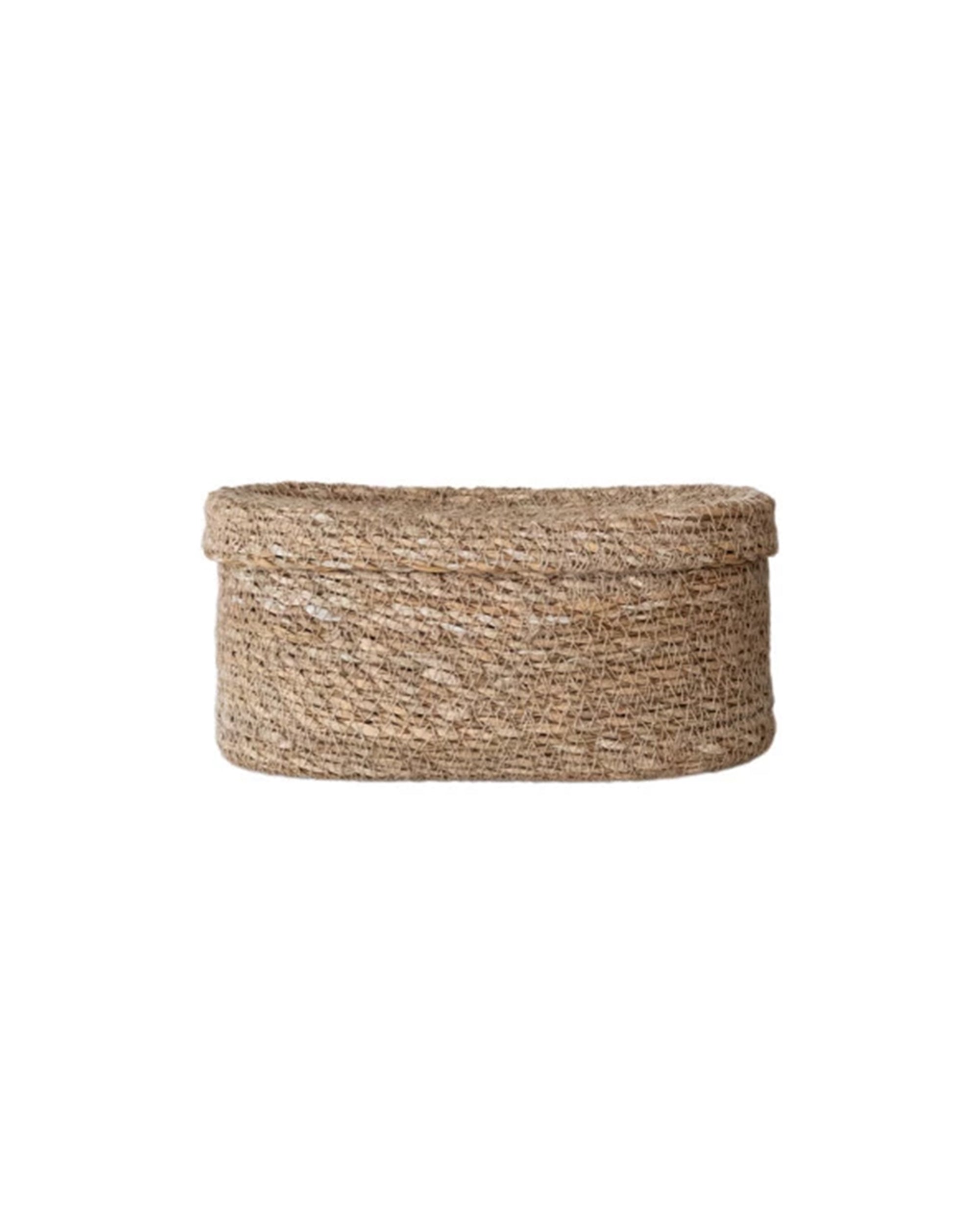 The Creative Co-op Sea Grass Basket (Long Oval) is a round, shallow storage basket made of hand-woven natural fibers, shown with its matching lid against a plain white background—a stylish addition to your home.
