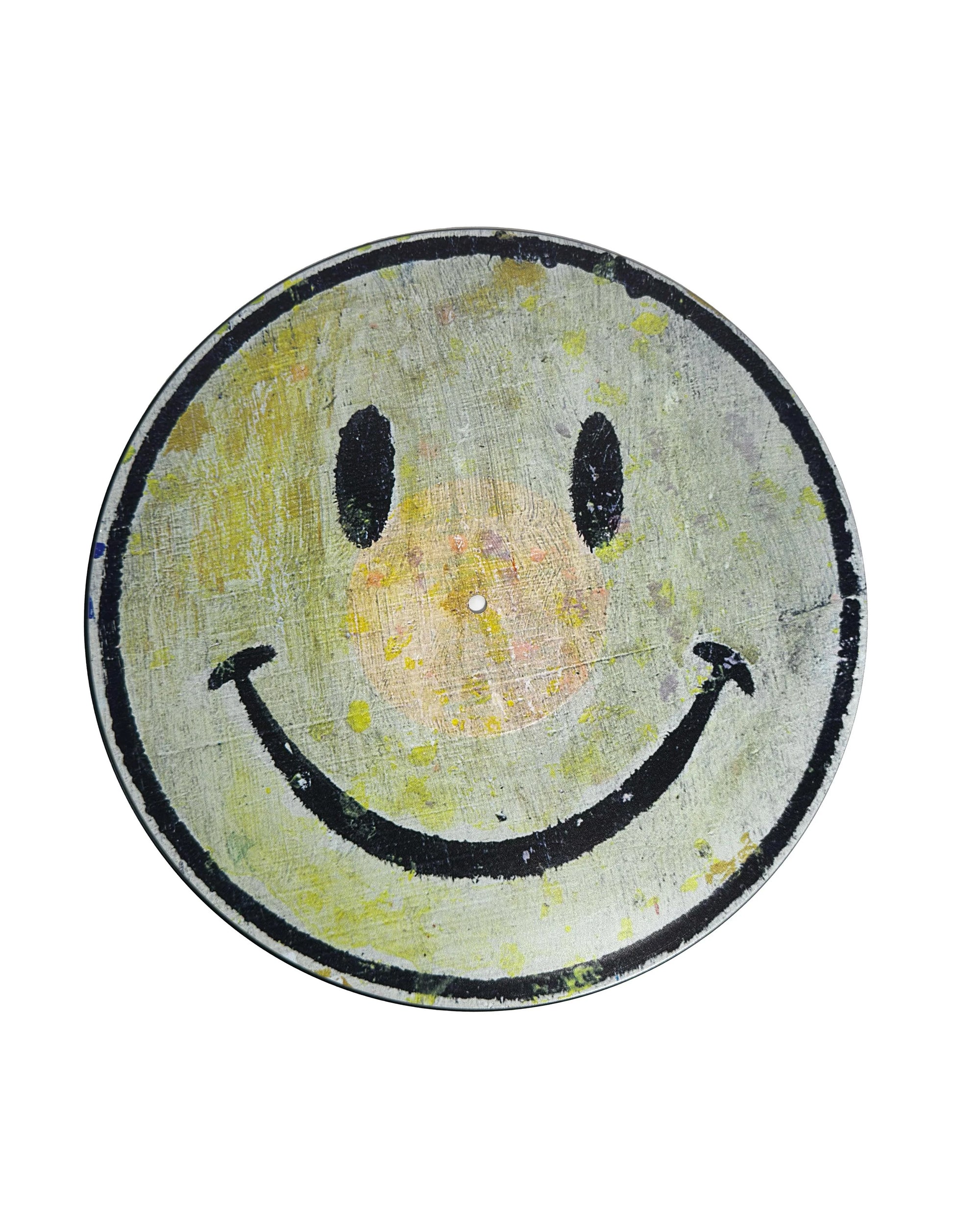 The Smiley Face Vinyl Record by Sugarboo Designs features a worn, painted smiley face on a circular vinyl with a gray background, black eyes and mouth, plus faint yellow and orange spots—an ideal quirky wall decoration.