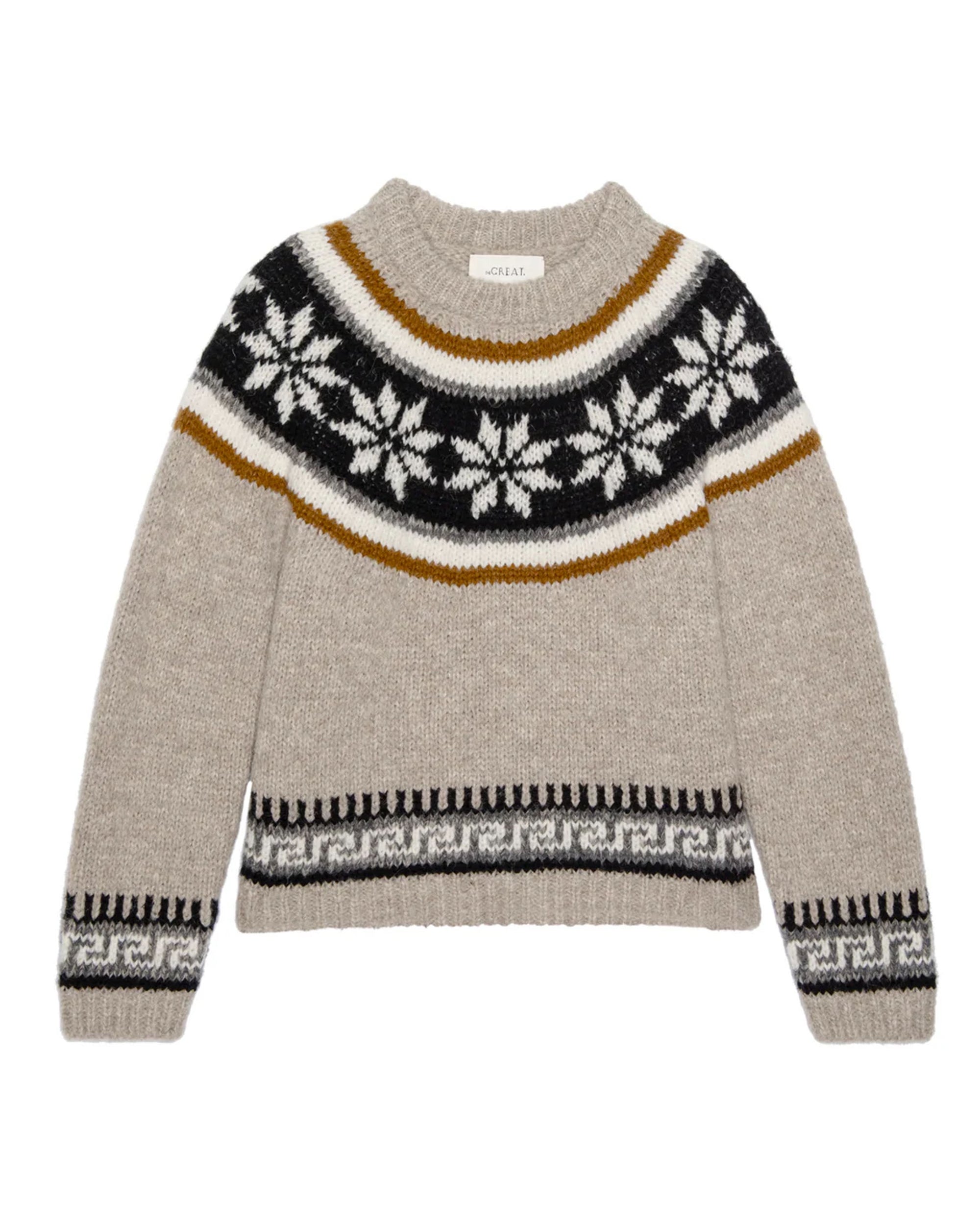 The Snowflake Fairisle Pullover by The Great Inc. is a beige knit sweater in Superfine Alpaca and Polyamide, featuring a round neck and black, white, and brown Nordic snowflake pattern. Fits true to size.