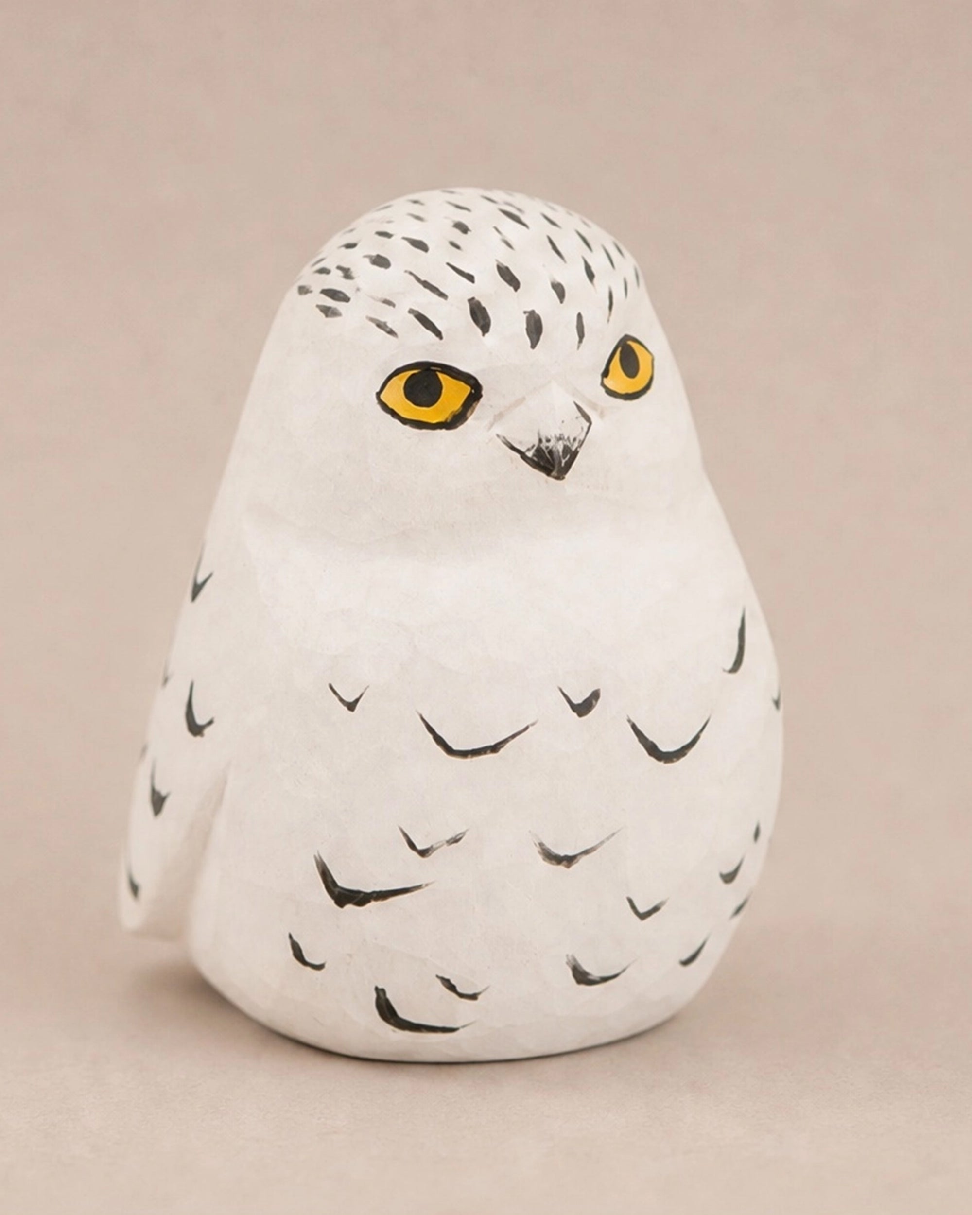 Hand-carved songbird figurine by The Faire, ideal for nature-themed décor or gifts from Bungalow Furniture &amp; Accessories.