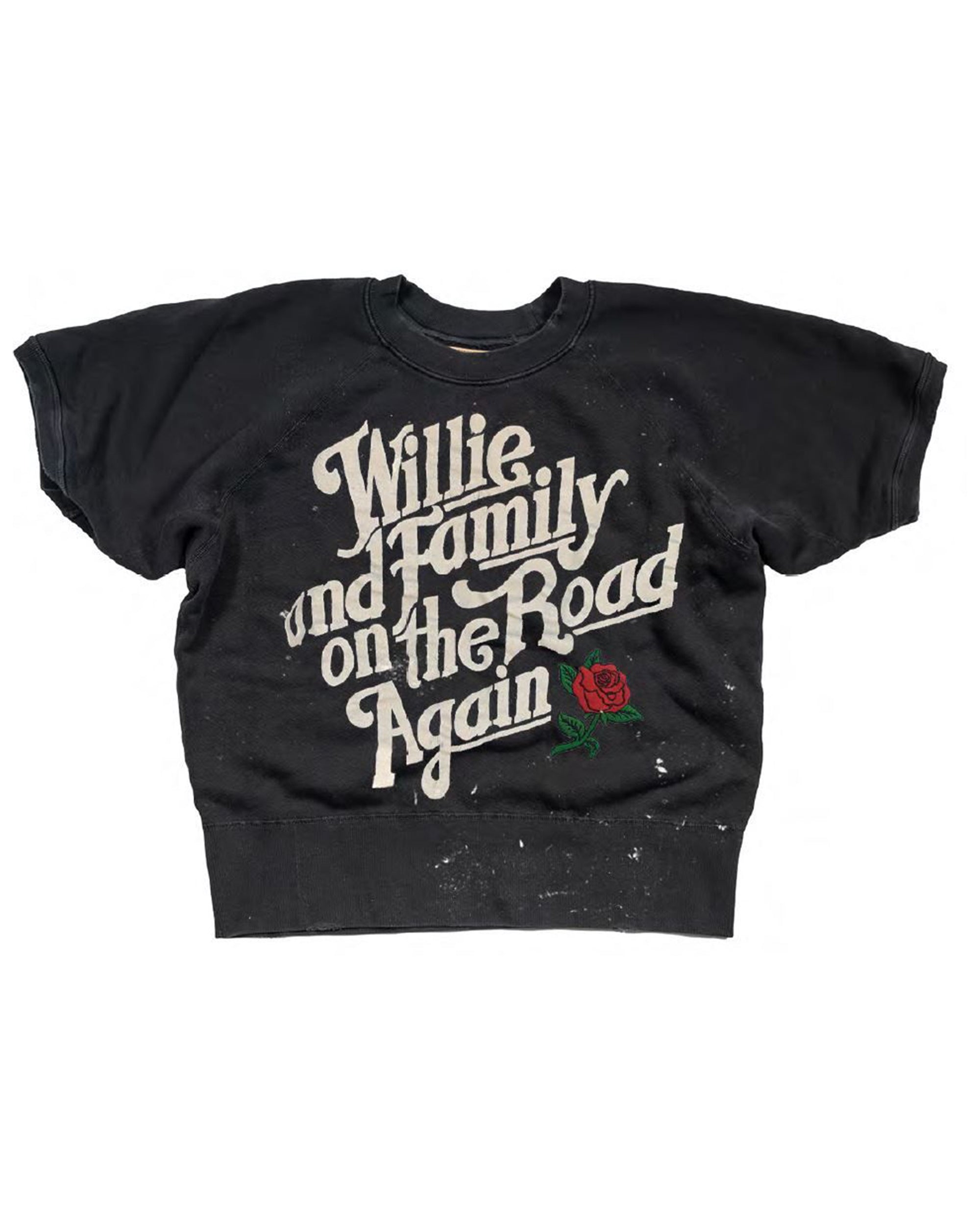 The Made Worn Short Sleeve Sweatshirt by Made Worn features black fabric, bold vintage-style white "Willie and Family on the Road Again" text inspired by Willie Nelson, and a small red rose graphic underneath.