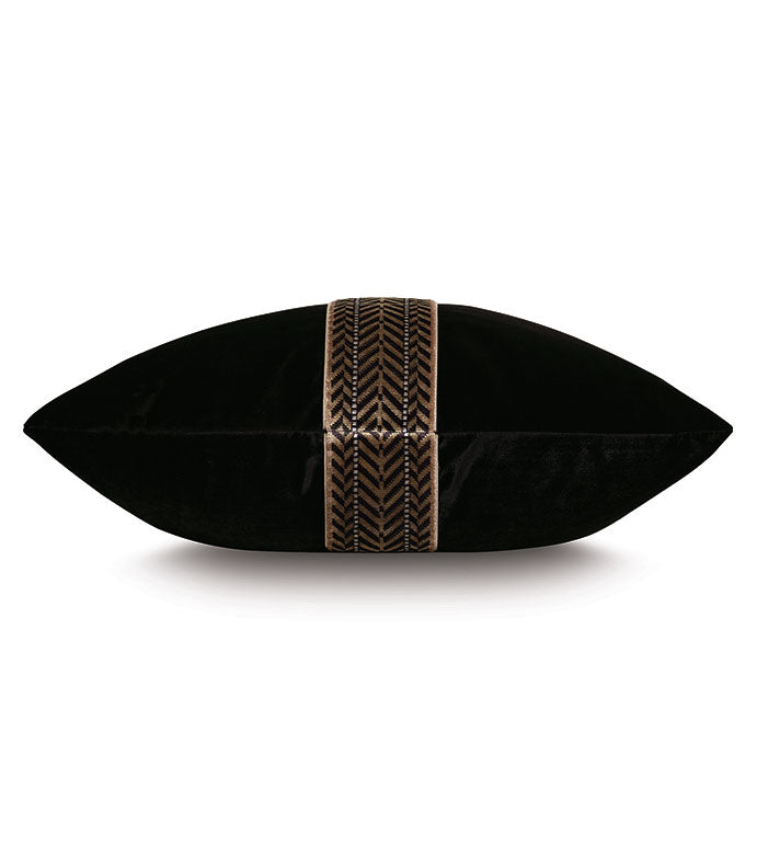 The EBONY CHEVRON pillow by Eastern Accents is a rectangular decorative piece in Winchester Ebony velvet, featuring a central brown and gold patterned band with an elegant vertical chevron trim.