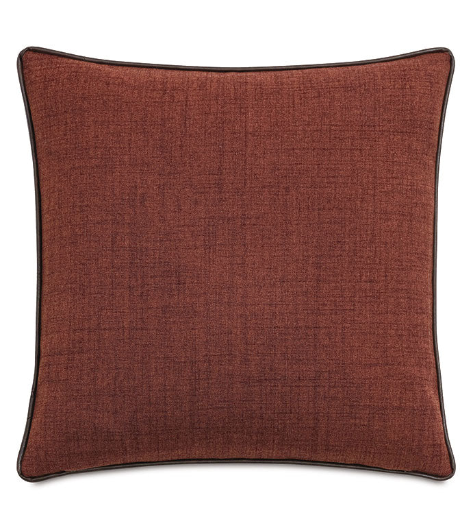 The EQUESTRAIN pillow by Eastern Accents features clay-red textured fabric and dark piping, adding subtle equestrian charm to any space. Shown on a white background.
