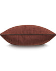 A side view of the Eastern Accents EQUESTRAIN clay-red pillow with a central seam, set against a white background—an elegant decorative accent for stylish interiors.