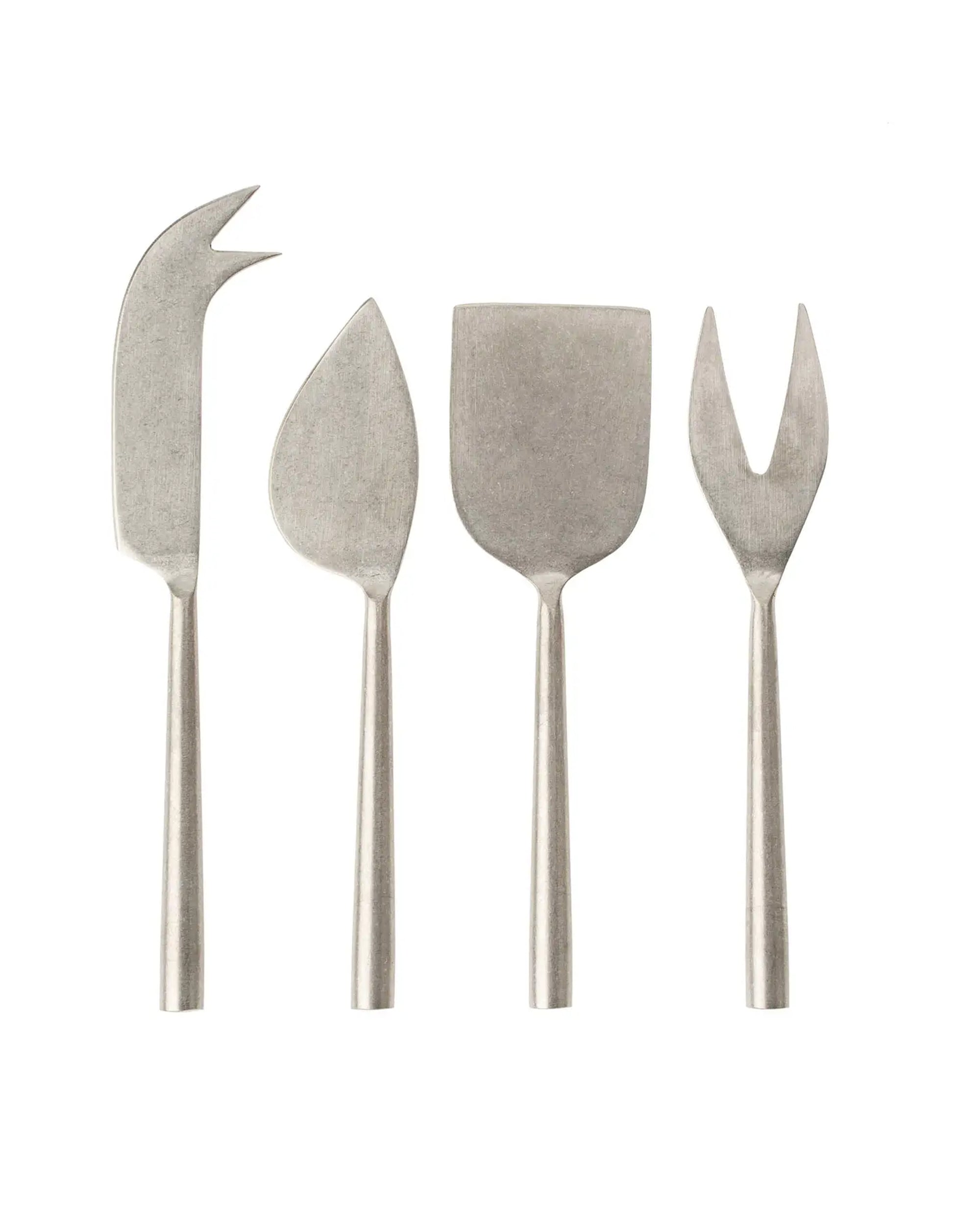 The Indaba Tides Cheese Knives S/4 Stainless features four uniquely shaped, hand-forged stainless steel cheese knives displayed in a row on a white background.
