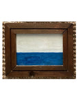 SKY & STARS by Tak Design is a small hand-painted art piece with a simple design—white on top, solid blue on the bottom, divided by a straight line—set in a rustic dark wood frame for vintage charm.