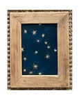 SKY & STARS by Tak Design features hand-painted art: a dark blue background with yellow stars, framed in vintage wood and displayed on a woven textured surface.