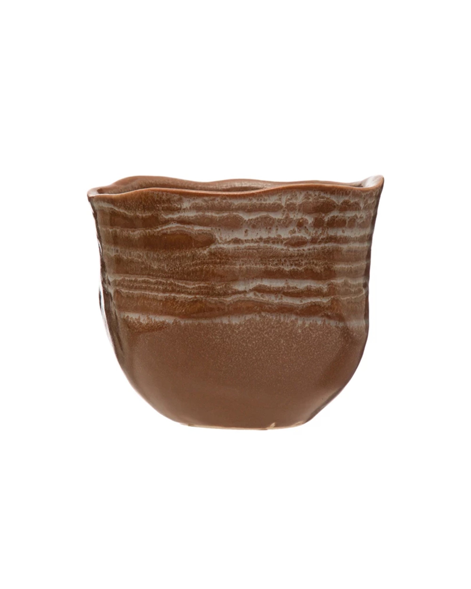 The Creative Co-op AH2781 Stoneware Planter features a handcrafted brown design with an uneven rim, textured horizontal patterns, and a reactive glaze, displayed against a plain white background.