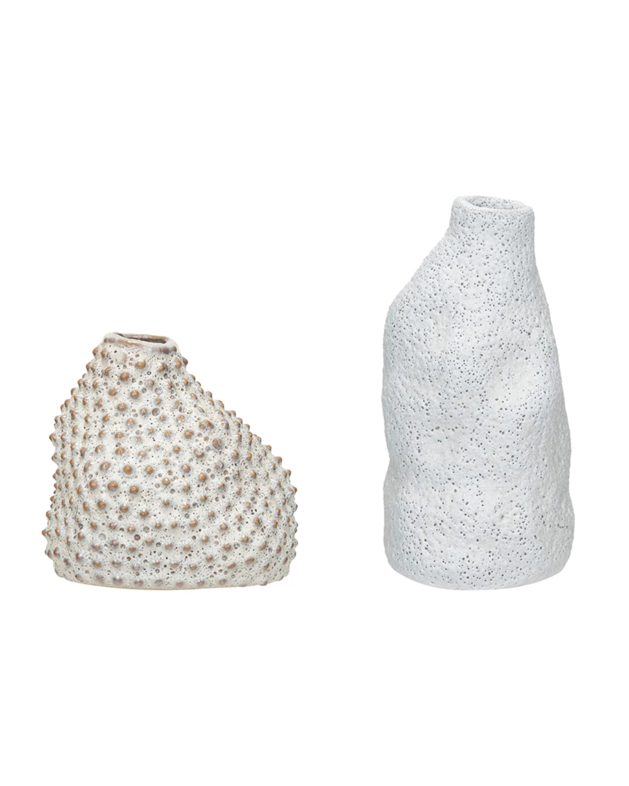 The Creative Co-op Organic Shaped Vase features textured stoneware; one vase is tan with a spiked pattern, while the other has a white reactive glaze, irregular shape, and rough surface.