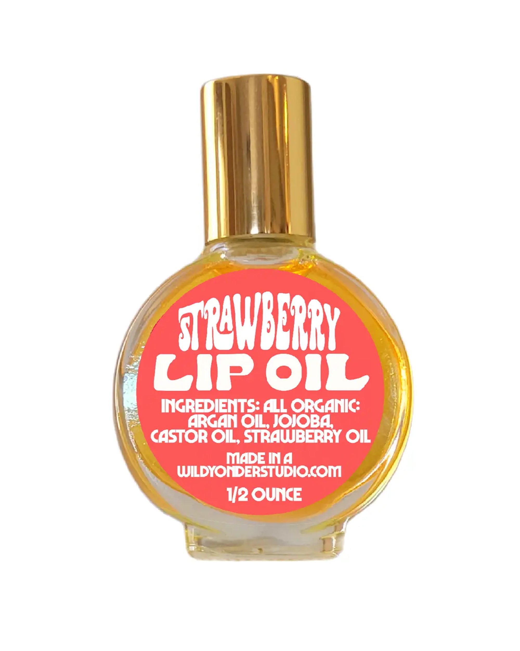 The Faire WYS Lip Oil comes in a round glass bottle with a gold cap. The 1/2 oz label reads "Strawberry Lip Oil" and highlights organic oils: argan, jojoba, castor, and strawberry isolate.