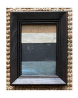 The STRIPES Framed Art by Tak Design features an abstract painting with beige, tan, off-white, black, and blue stripes in a small dark wooden vintage frame. Its woven background and hand-painted style add character to any space.