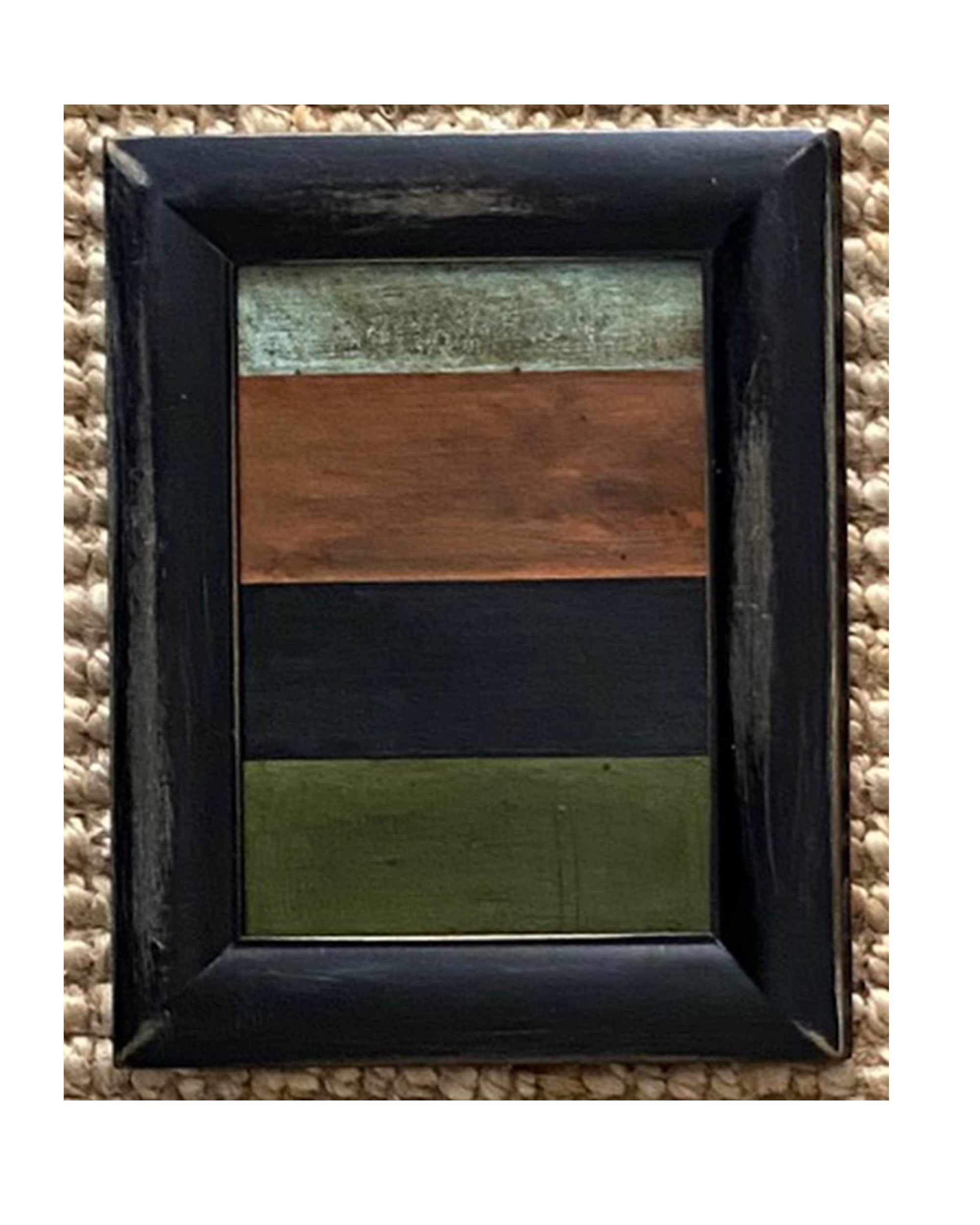 The STRIPES Framed Art by Tak Design features a black vintage frame with multicolored stripes, showcasing hand-painted artwork by a local artist.