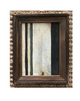 The STRIPES Framed Art by Tak Design features vertical black, dark green, and off-white stripes on a textured backdrop, accented with a thick wooden frame and displayed against a woven surface.