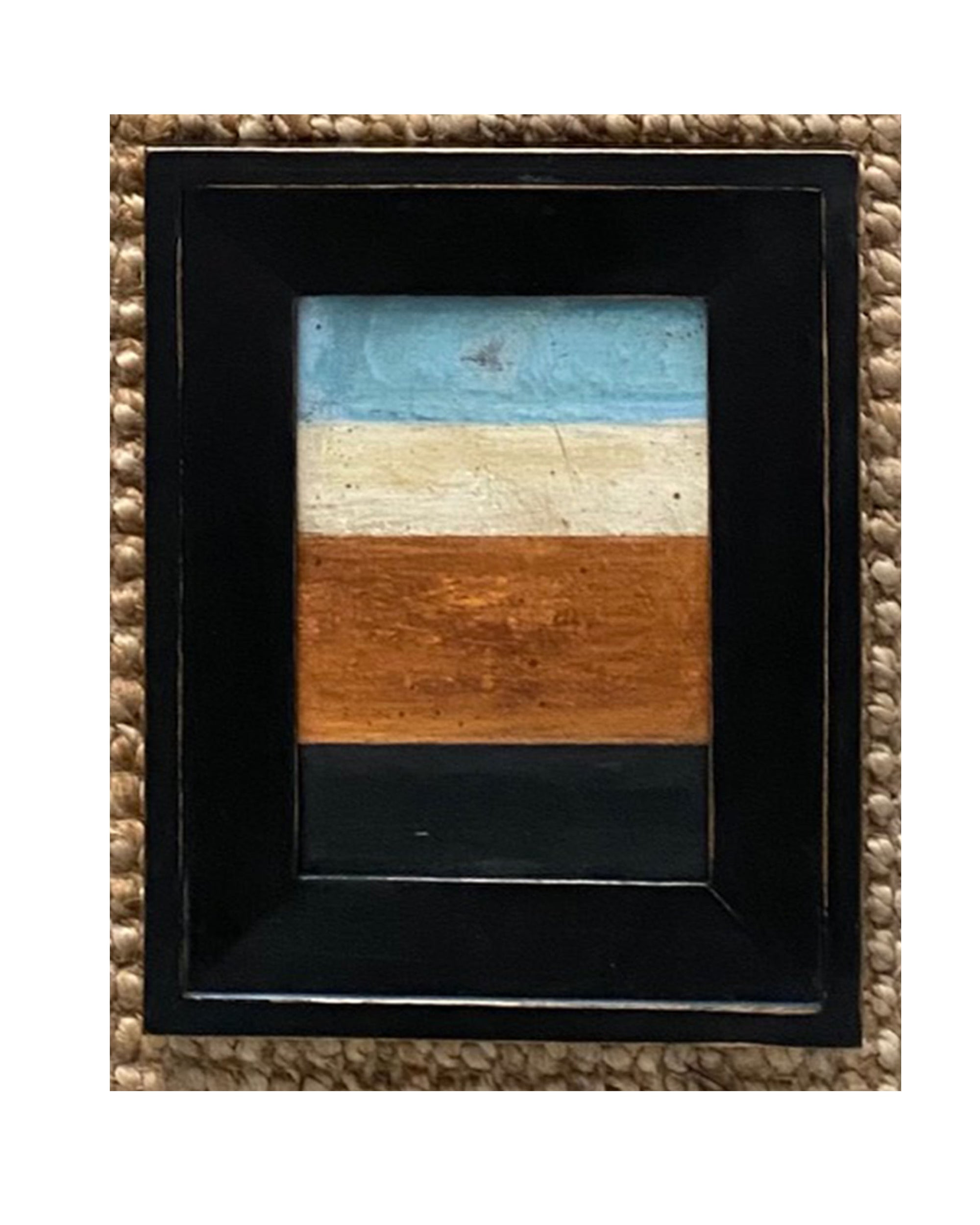 STRIPES Framed Art by Tak Design features four hand-painted horizontal stripes—blue, off-white, brown, and black. Set in a thick black frame over a textured woven mat, this abstract piece is crafted by a local artist.