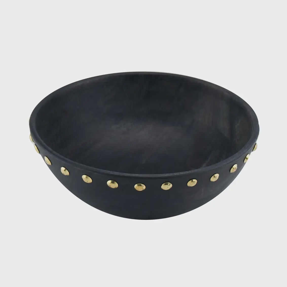 A black ceramic bowl with a matte finish, adorned with a series of evenly spaced small metal studs around the rim. The Studs Bowl S by Godinger (Faire) is simple yet elegant, against a plain white background.