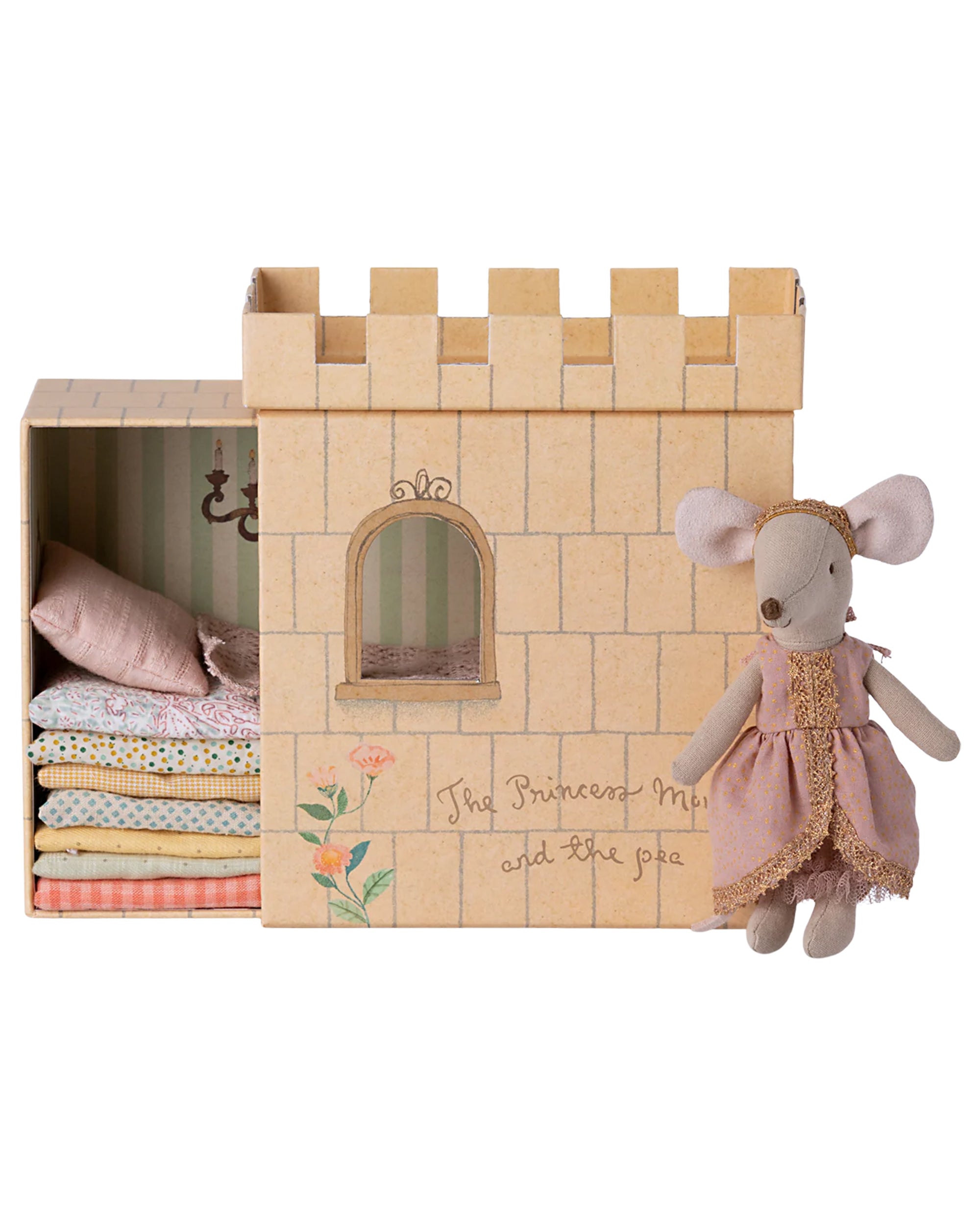 A Maileg Mouse toy from Maileg stands by a cardboard castle box labeled “The Princess and the Pea,” featuring stacked miniature bedding and mattresses inside.
