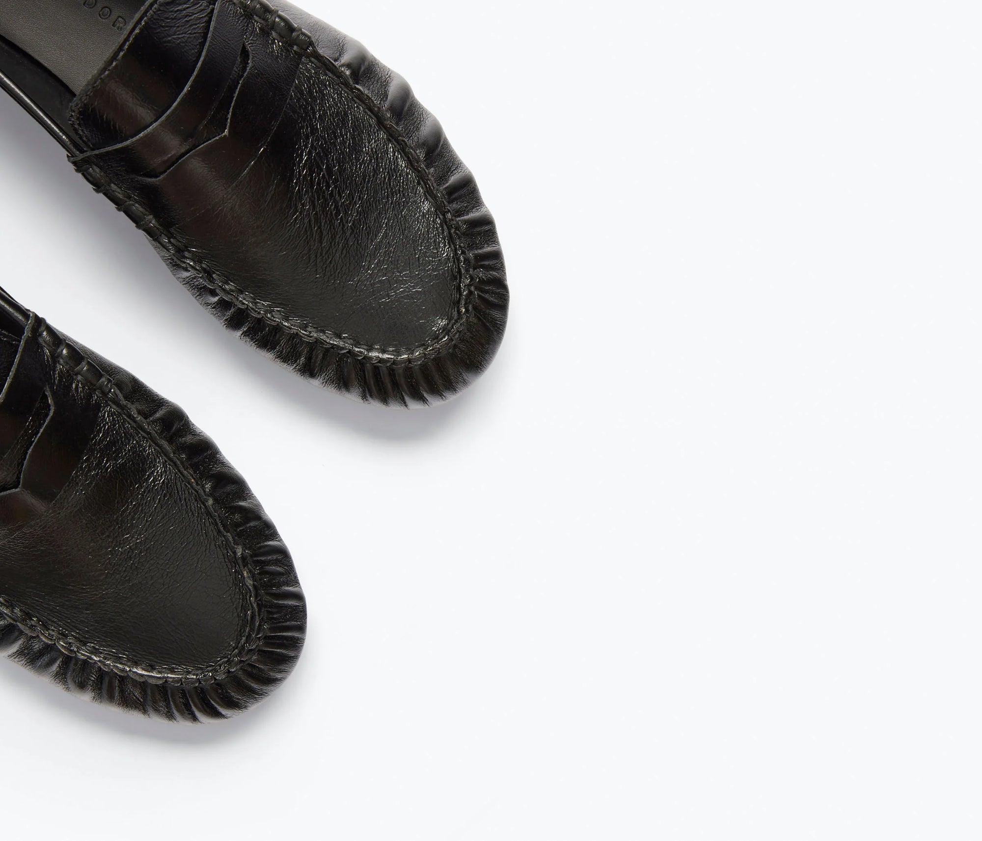 Close-up of the front portions of Freda Salvador's Sydney Crinkle Loafer, showcasing detailed toe stitching on Italian leather against a plain white background.