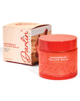 A red jar labeled "Magnesium Lavender Tallow Cream 4oz" sits beside its matching box, both with Faire branding and a soft pink-orange design. The cream is infused with tallow and magnesium.