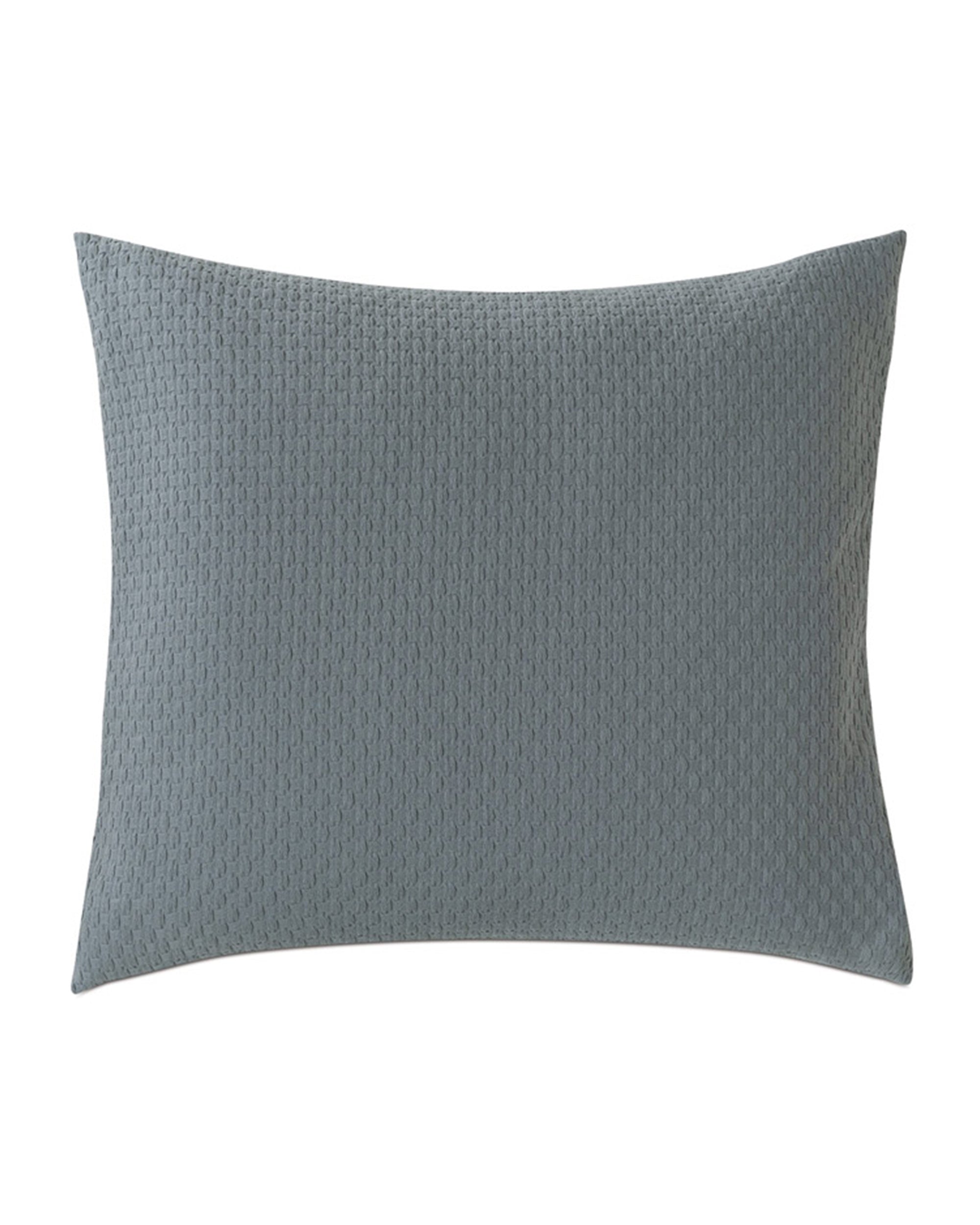 The Eastern Accents Tegan Matelasse euro sham pillow in teal features a subtle textured pattern and is set against a plain white background.