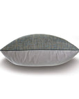 The ROWLEY WOVEN TEAL decorative pillow by Eastern Accents features a multicolored design with textured blue-gray velvet on the top half and smooth light gray fabric on the bottom, displayed against a white background.