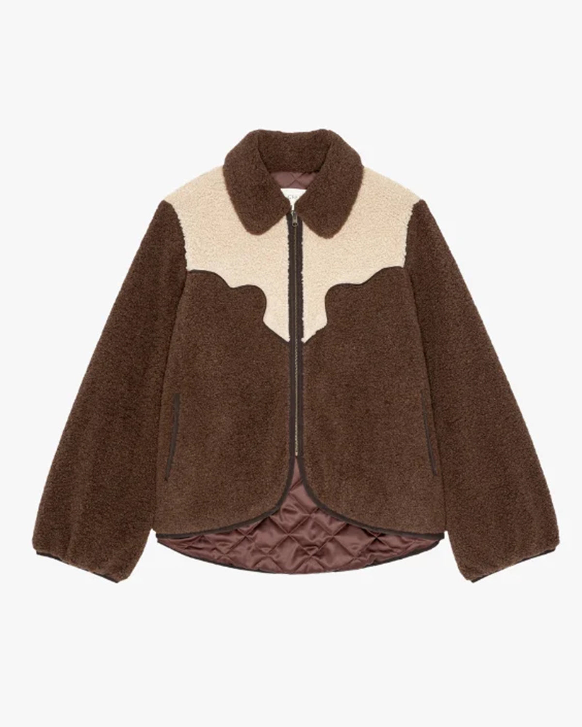 Brown sherpa jacket with cream yoke, quilted lining, and zipper by The Great Inc. at Bungalow Furniture &amp; Accessories.