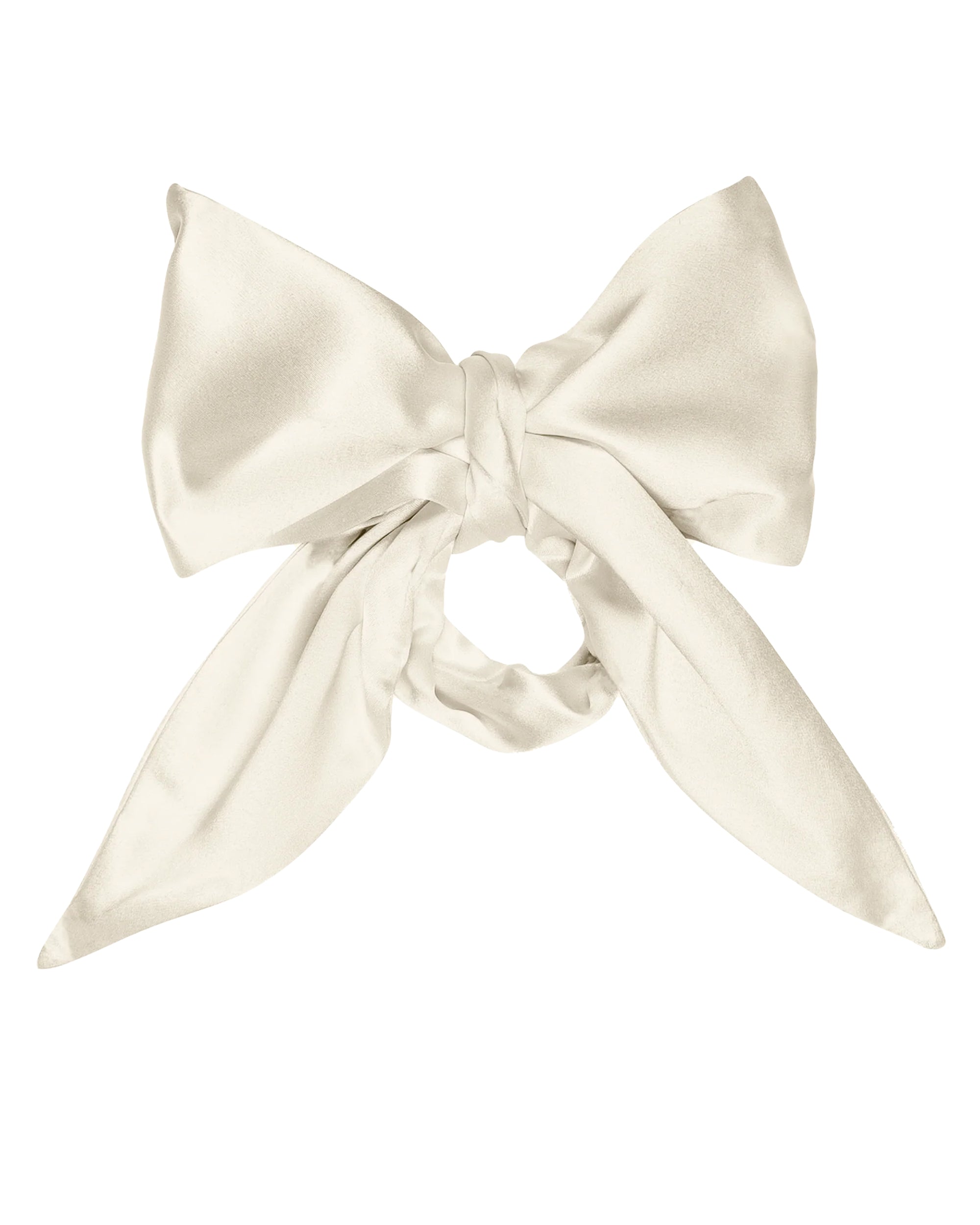 The Silk Bow by Donni is a large, cream-colored 100% silk accessory with long, elegant tails, neatly tied and displayed against a plain white background.