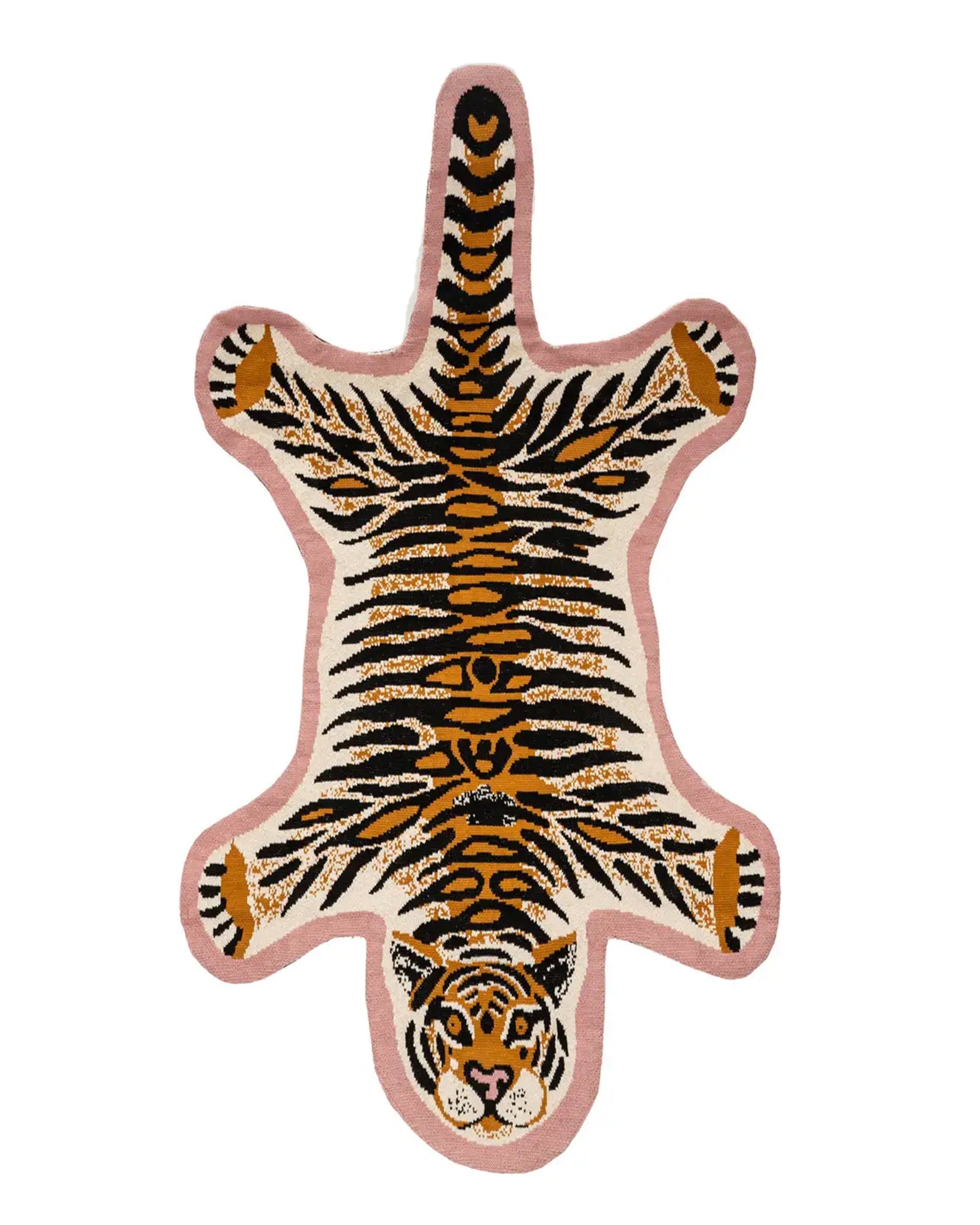 The Indaba Tiger Knit Rug 3x5 features a fun tiger shape with cartoon face, orange and black stripes, and a light pink border—this handmade rug is perfect for adding playful style to any kids room.
