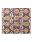 The Bloomingville Cotton Throw / Tibetan Tigers features a rectangular woven design with geometric and animal patterns in gold, purple, blue, and red. Fringed edges on the short sides add texture—ideal for boho decor.