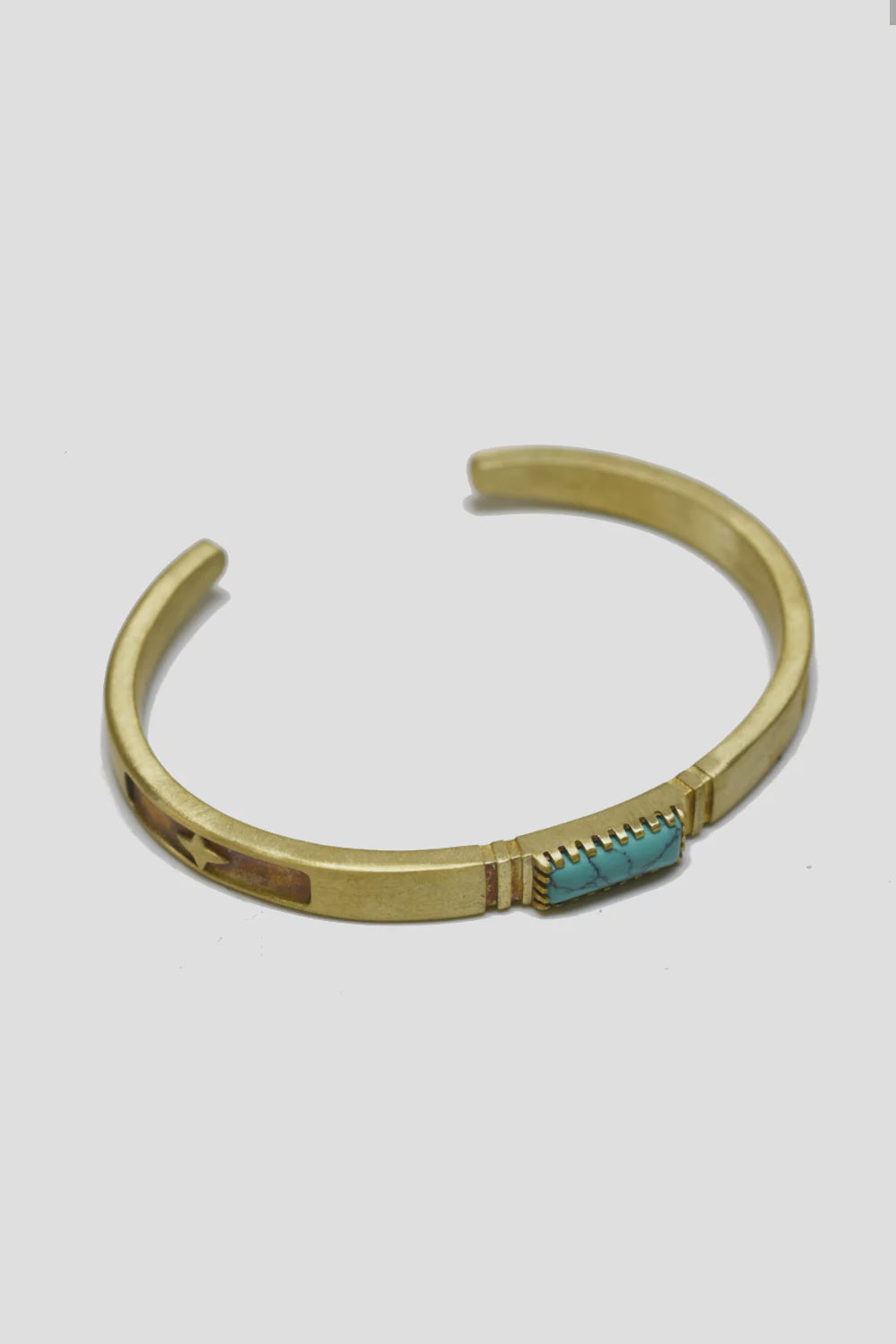 The MENS Turquoise Inlay Bracelet by Curated Basics is a handmade gold cuff with an open design crafted from solid brass. It highlights a vibrant turquoise stone at its center, complemented by subtle etched patterns on the metal against a plain white background.