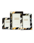 The Two’s Company ARU032 Black Horn Photo Frame features handcrafted elegance with a glossy multicolored striped pattern in black, white, brown, and beige, displaying “Tozai Home” inserts—perfect for elevating any space.