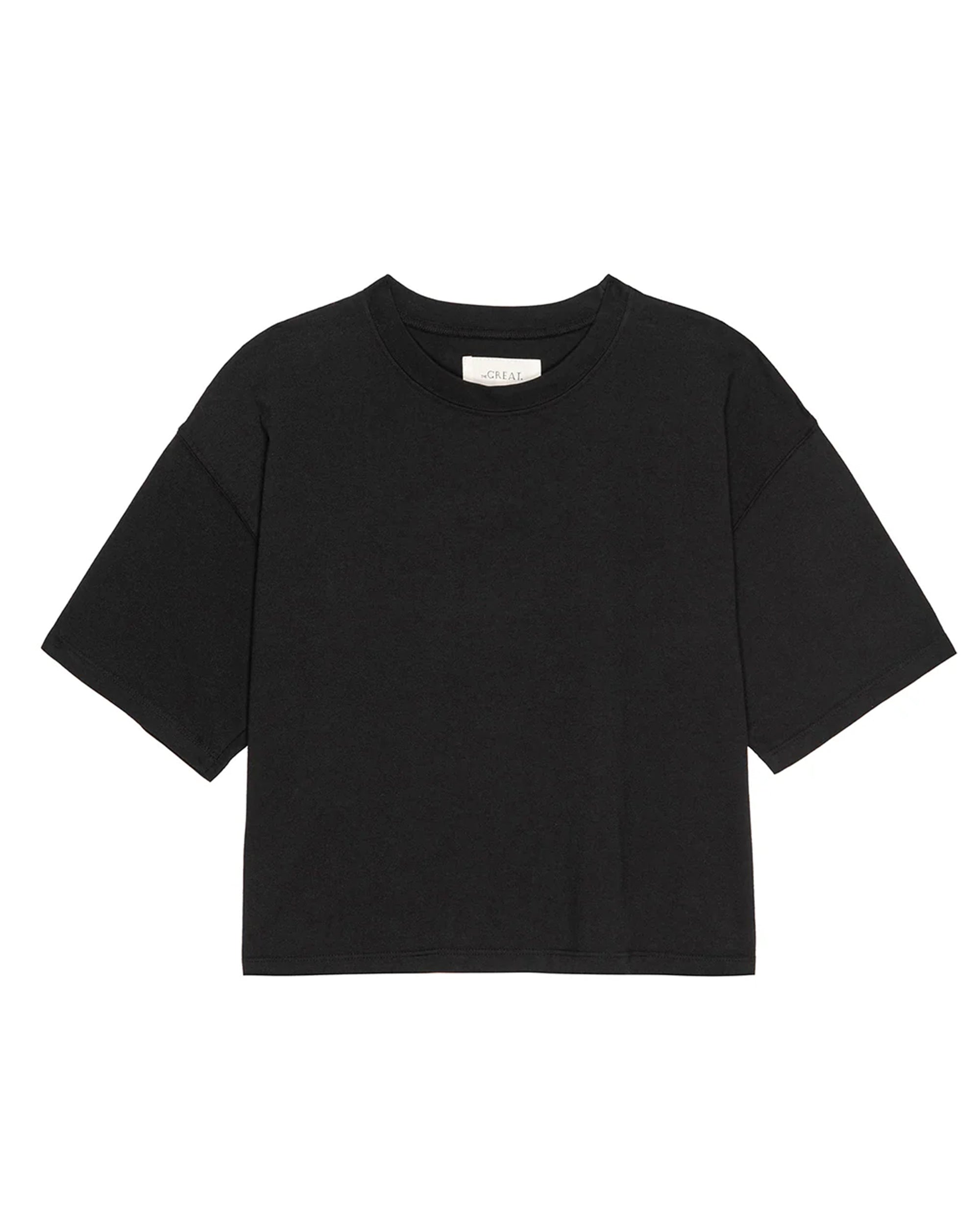 The Track Crew by The Great Inc., a plain black short-sleeve t-shirt with a crew neckline and dropped shoulders, is laid flat on a white background.