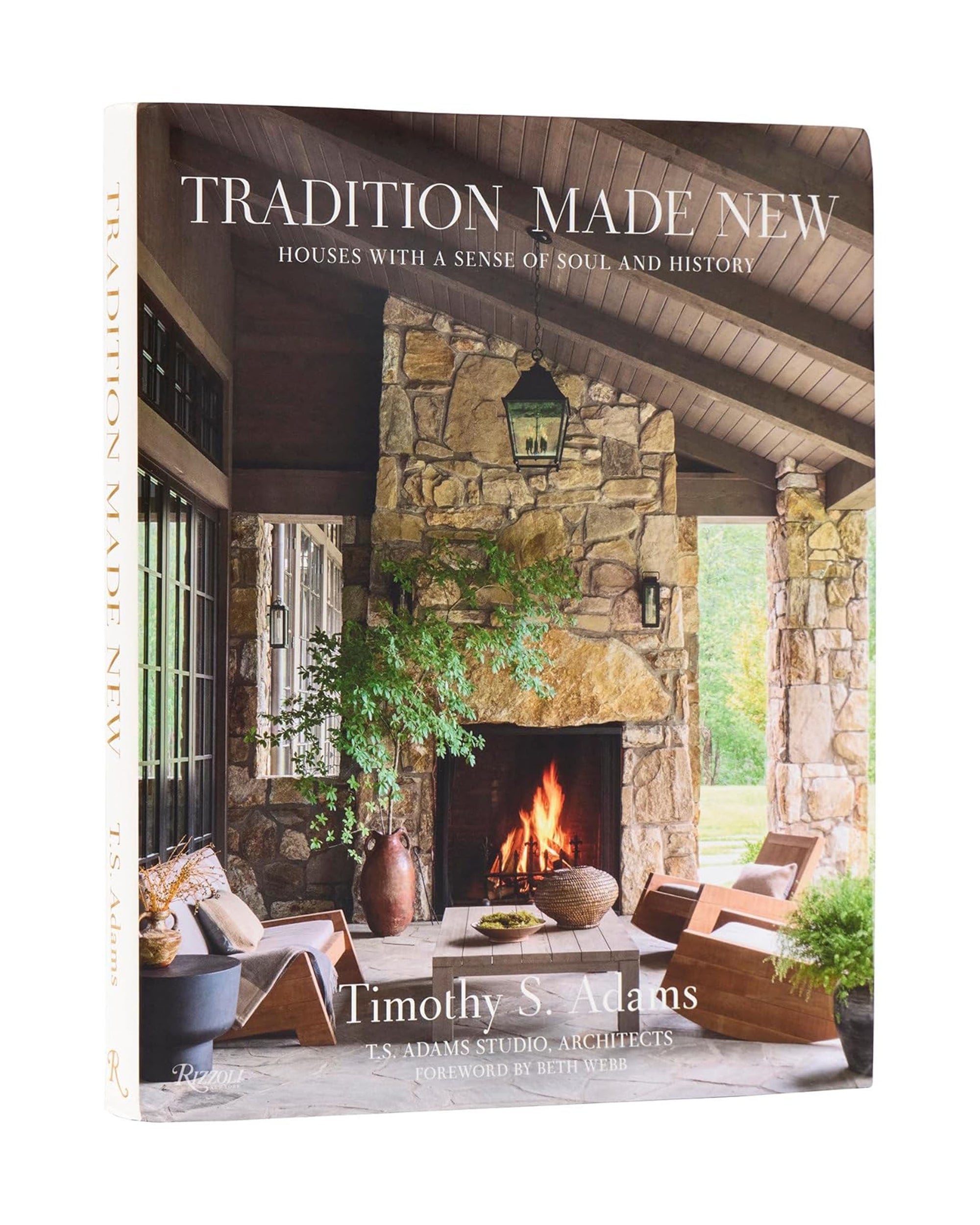 The "Tradition Made New" book by Random House features a cover with a cozy outdoor living space—stone fireplace, wooden ceiling, wicker chairs, and lush plants—showcasing traditional houses and natural materials under a covered patio.