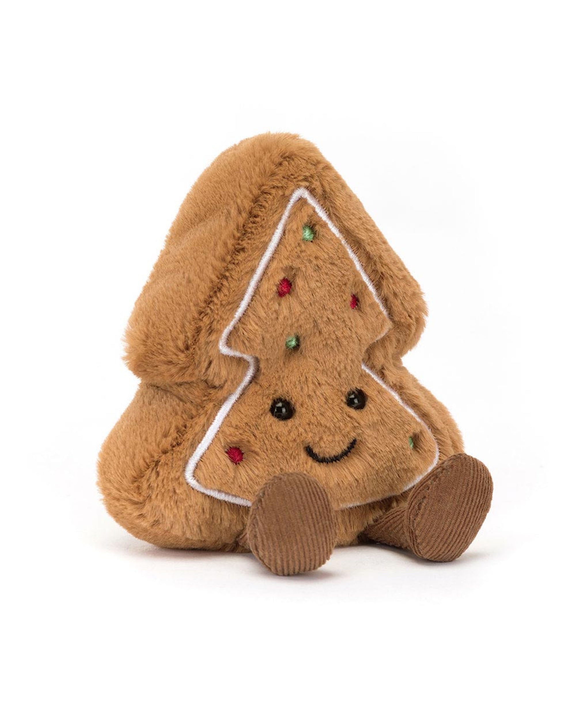 The Amuseables Tree Cookie by Jelly Cat Inc. is a plush Christmas tree cookie with brown fuzzy fabric, white icing trim, colorful dots, a smiling face, and brown corduroy feet—ideal for gifting or festive displays.
