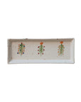 The Creative Co-op Tree Platter is a rectangular hand-painted stoneware tray with a speckled pattern, featuring three Christmas trees dotted with color and topped with orange stars—perfect for festive holiday gatherings.