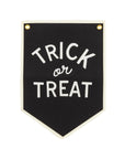 Canvas Trick or Treat banner with white text, border, and gold grommets by Bungalow Furniture for Halloween décor.