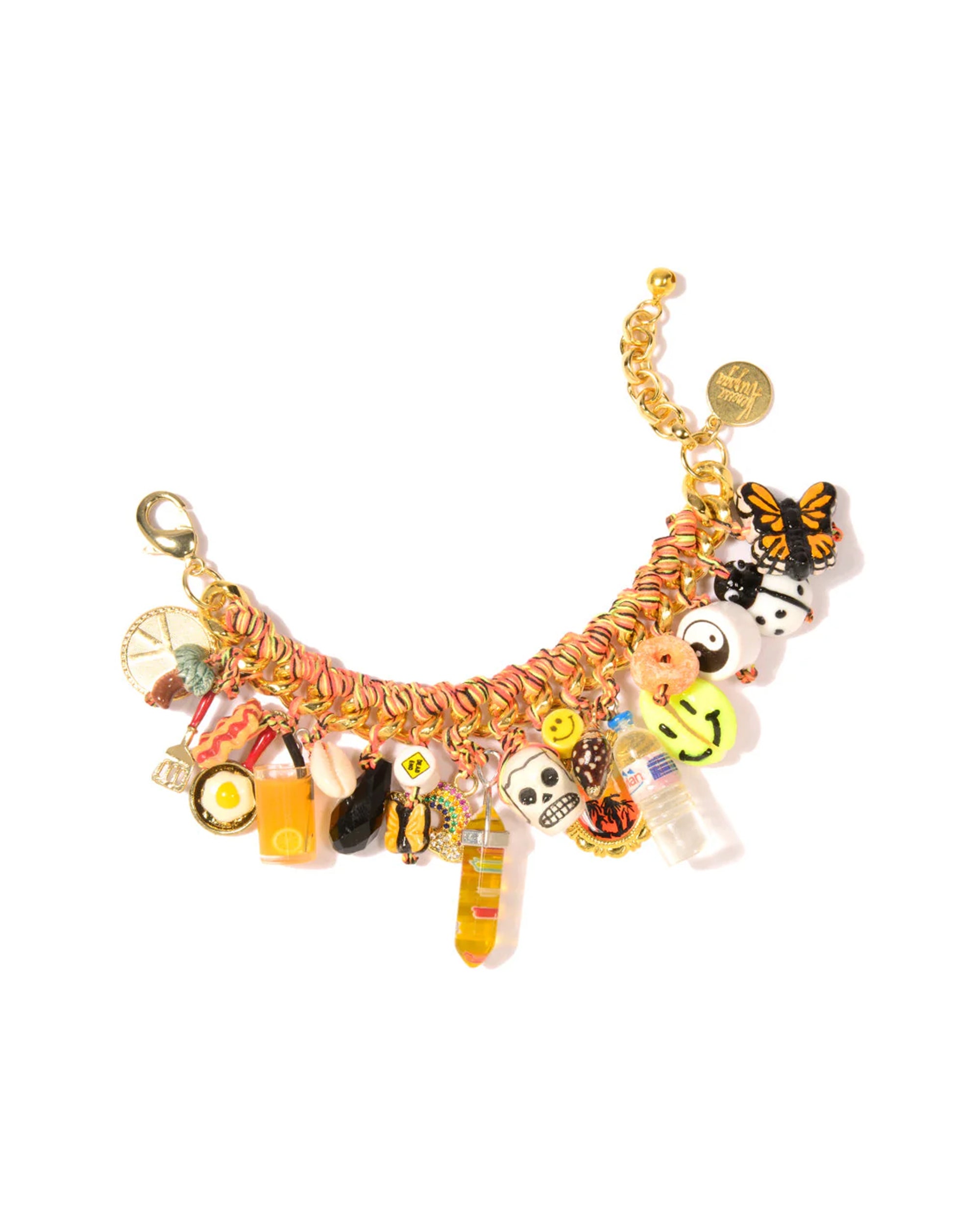 The Venessa Arizaga Tropical Treats Gold Plated bracelet is colorful and handcrafted, featuring gold links and playful charms—a butterfly, smiley face, orange drink, and candy—making it perfect vacation jewelry shown on a white background.