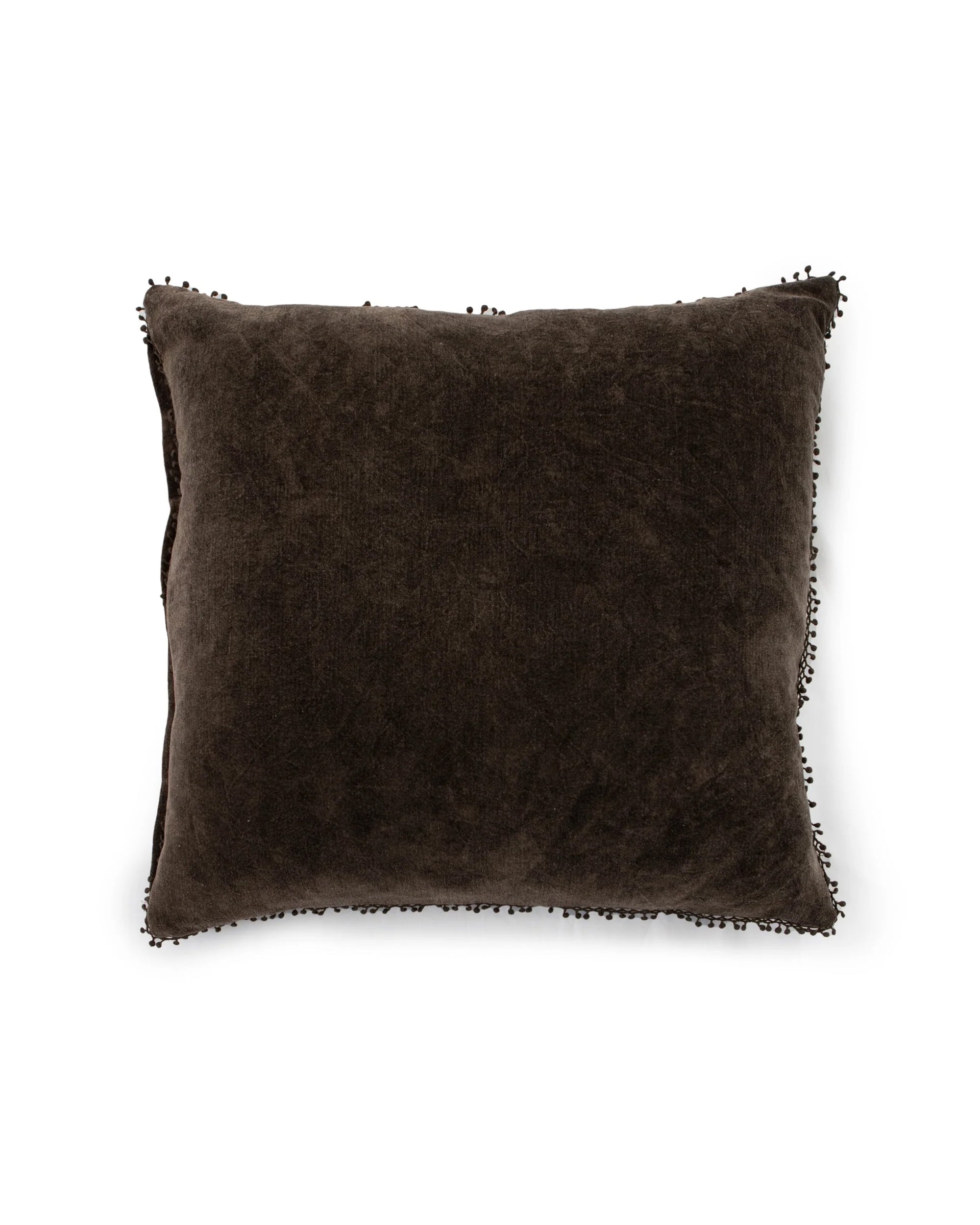 The Velvet Pillow W/ Poms by Sugarboo Designs is a square, dark brown velvet accent pillow featuring a soft down feather insert and small textured pom-pom trim, displayed against a white background.