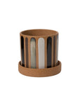 The Truman Pot/Saucer 7.75x7" by Accent Decor is a brown ceramic planter with a matching saucer, hand painted with black, white, and gray vertical stripes—perfect for adding decorative flair to any space.