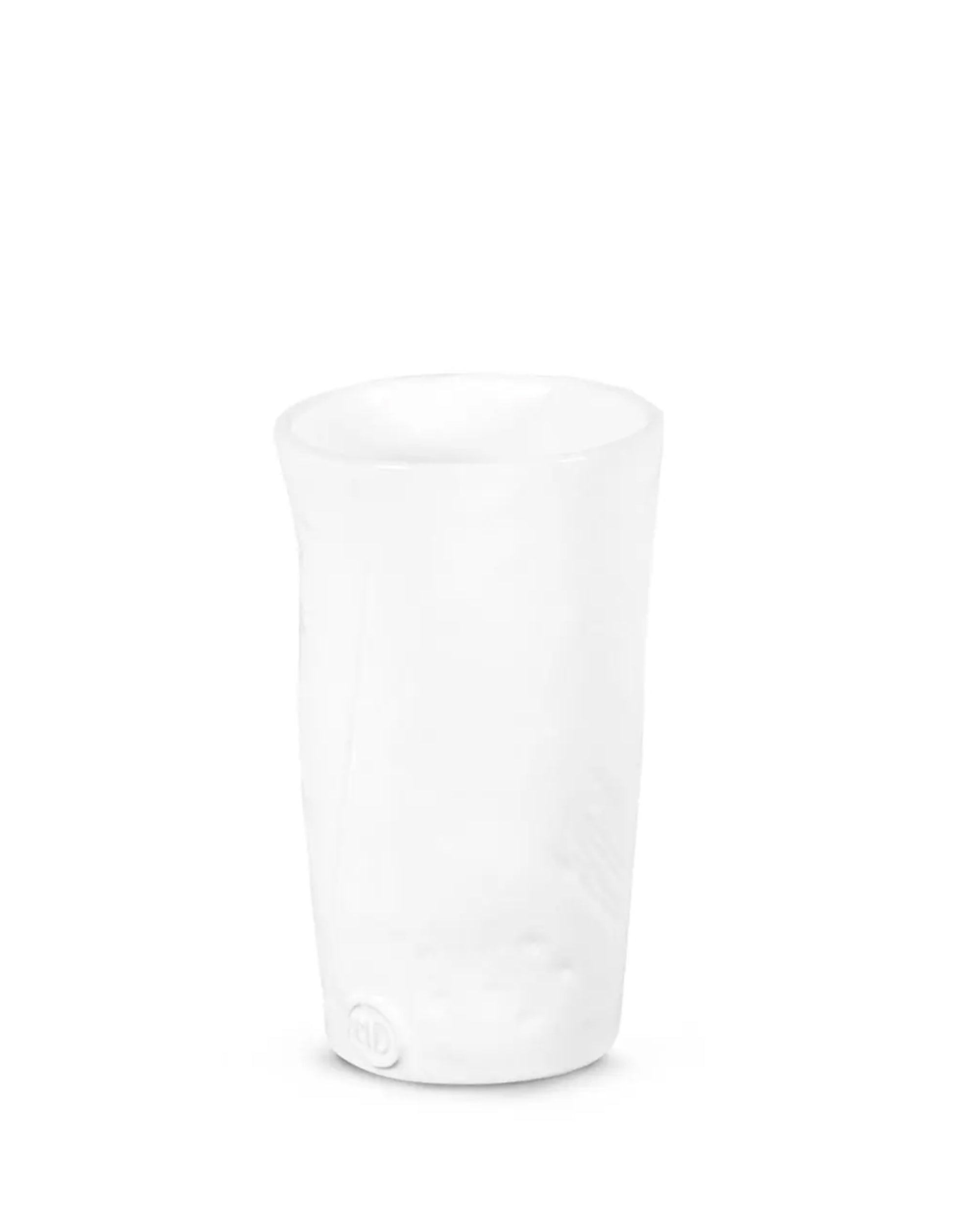 The Montes Doggett 5303 Tumbler No. 303 is a white ceramic cup with a handcrafted, slightly uneven shape and smooth surface, featuring a small circular mark near the base. Microwave and dishwasher safe. Plain white background.