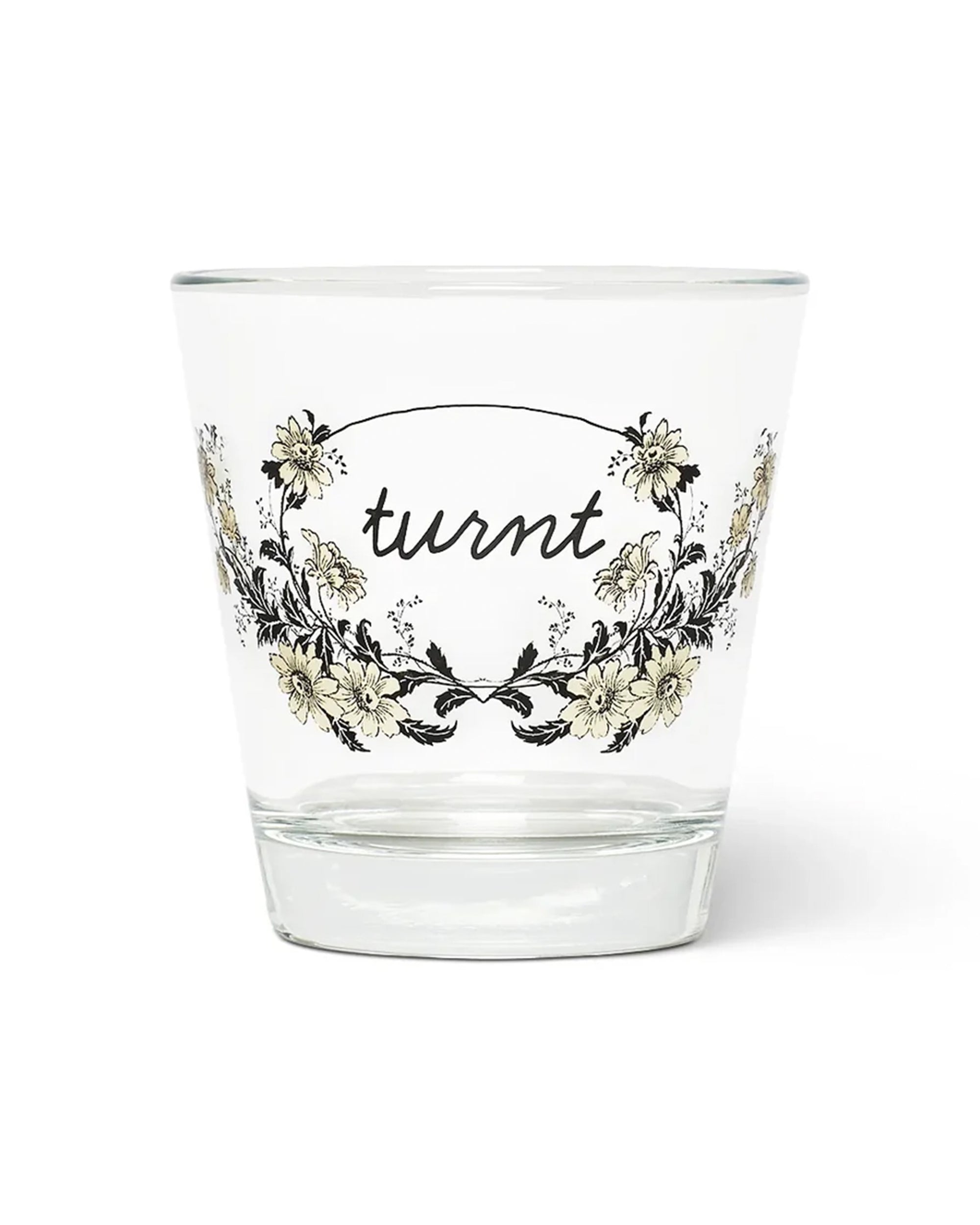 Clear Fishes Eddy Turnt Tumbler with floral pattern and turnt script in soda lime glass, dishwasher safe.