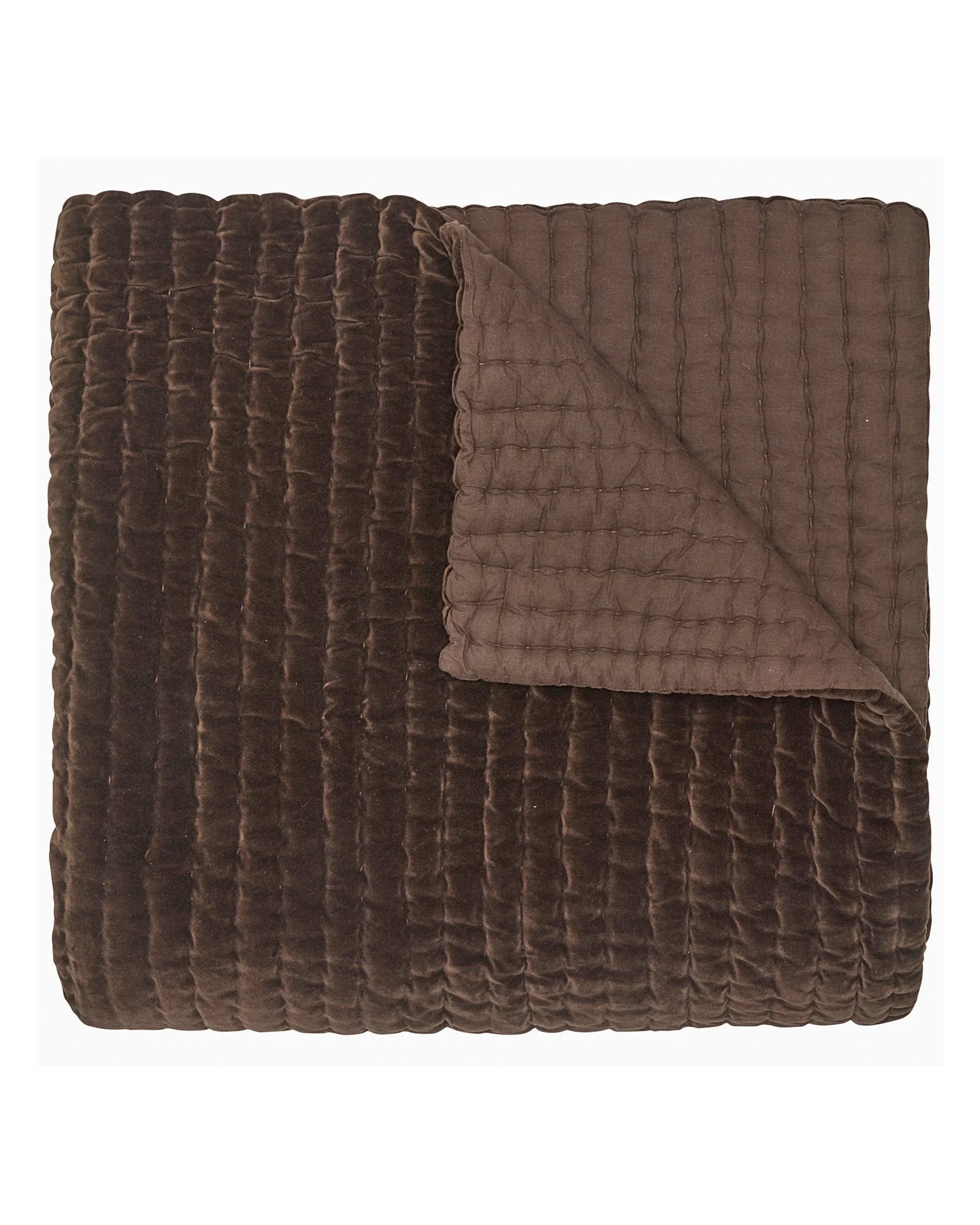 The John Robshaw Velvet Coverlet King features a folded, quilted brown velvet design with a soft, textured surface and smooth underside, hand quilted for a cozy, plush feel.