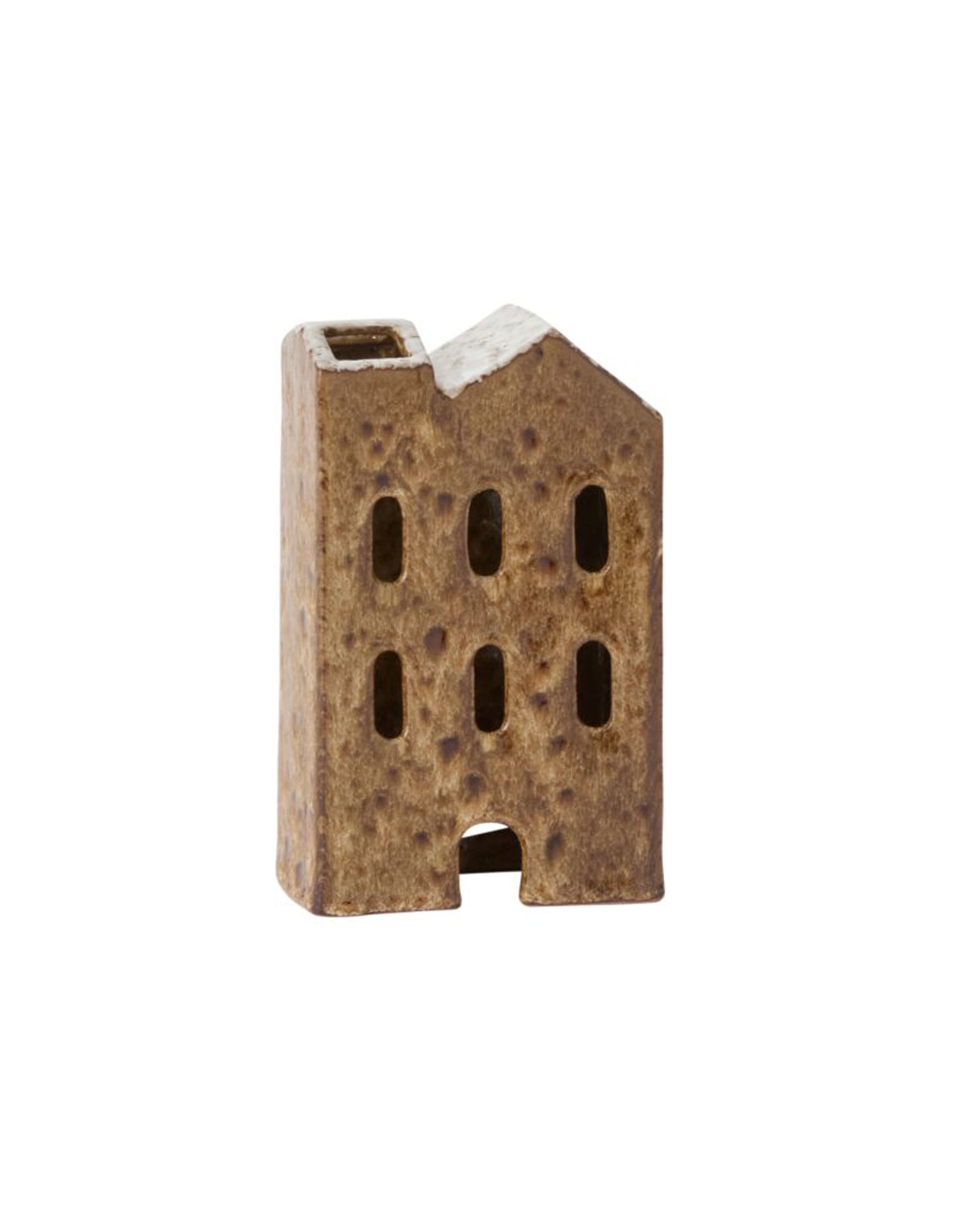 Accent Decor’s Village House is a small, brown ceramic sculpture shaped like a building with four windows and a door. Its textured, speckled finish makes it a charming addition to your holiday decor or ceramic village houses display.