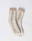 The Faire Vintage Stripe Floral Socks feature cream stripes, beige cuffs, toes, and heels, plus a vintage-inspired floral pattern with small pink flowers and green leaves.
