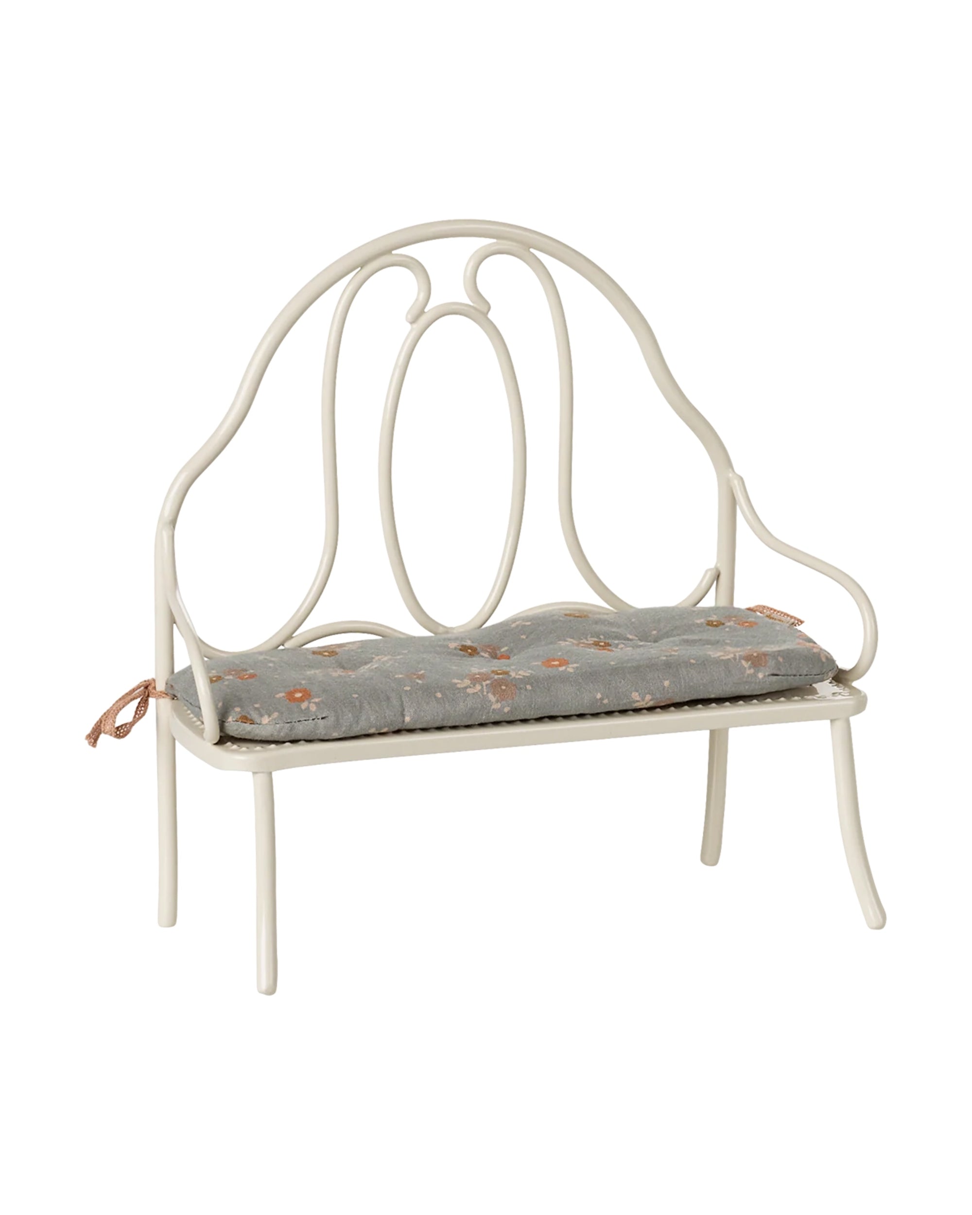 Vintage-style bench with curved backrest and floral cushion by Maileg, perfect for cozy living spaces.