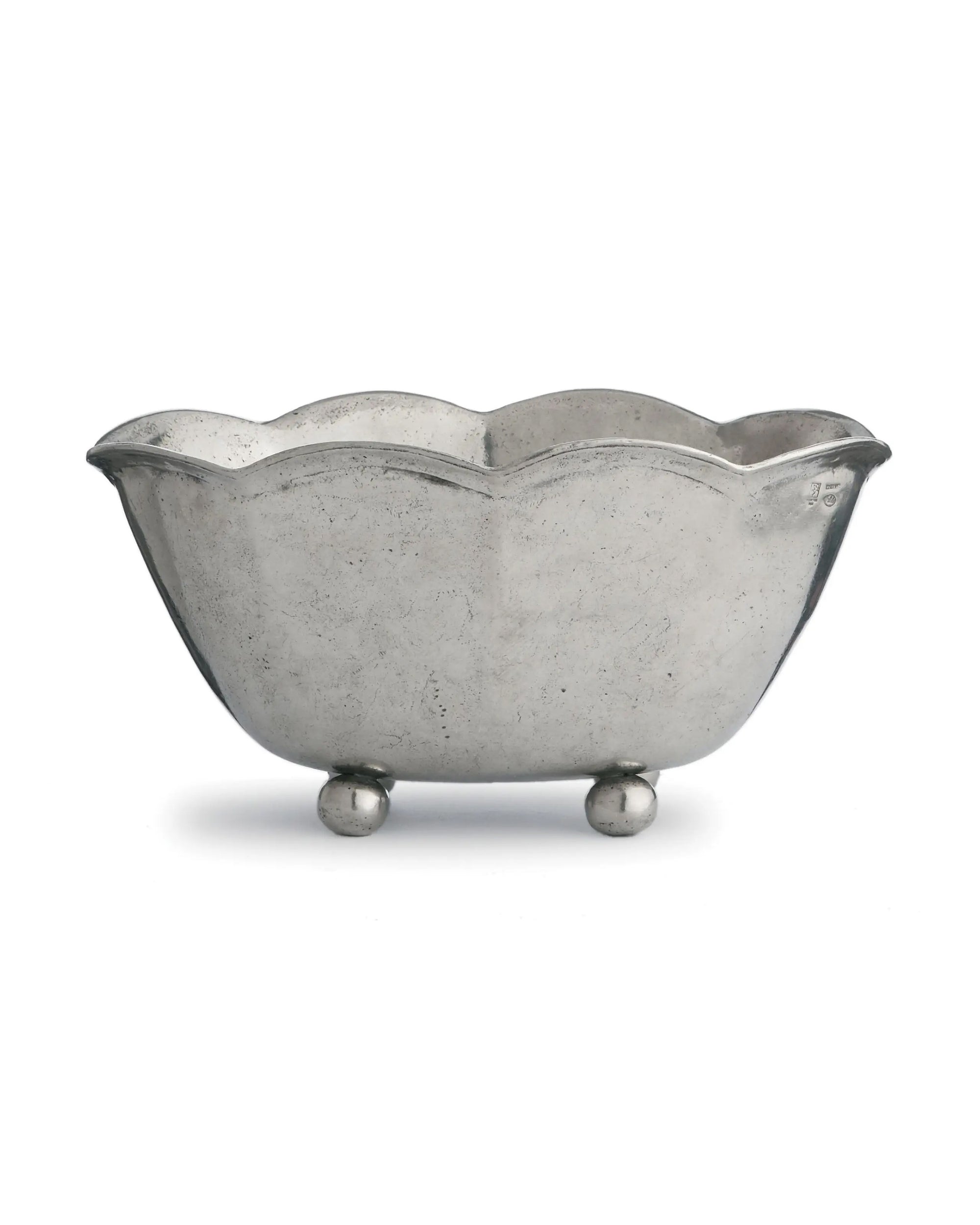The Faire Vintage Scalloped Bowl features a scalloped rim, rounded sides, and three round feet. Handmade in Italy, this elegant pewter serving piece is shown against a plain white background.